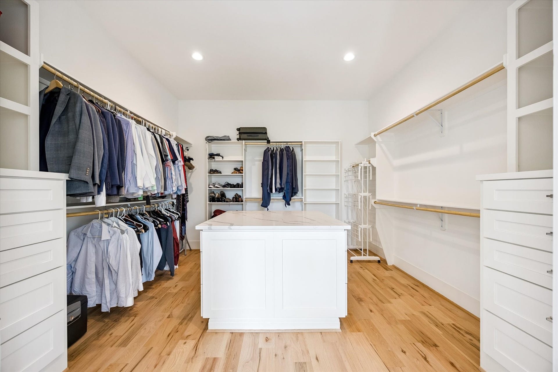Prepare to be wowed by the expansive primary closet, where custom built-ins, abundant storage and an impressive amount of space create a true dream-worthy dressing retreat.