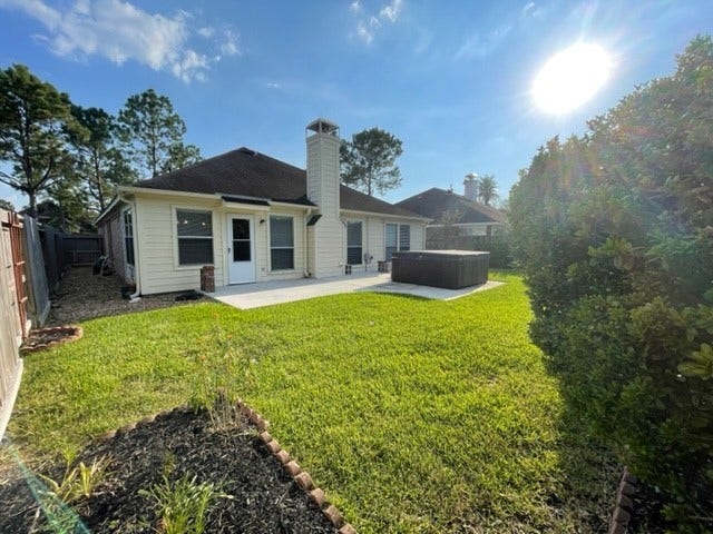3511 Paigewood Drive, Pearland, TX 77584 Charming backyard with a spacious patio, lush lawn, perfect for outdoor entertaining and relaxation. Hot tub is being removed.