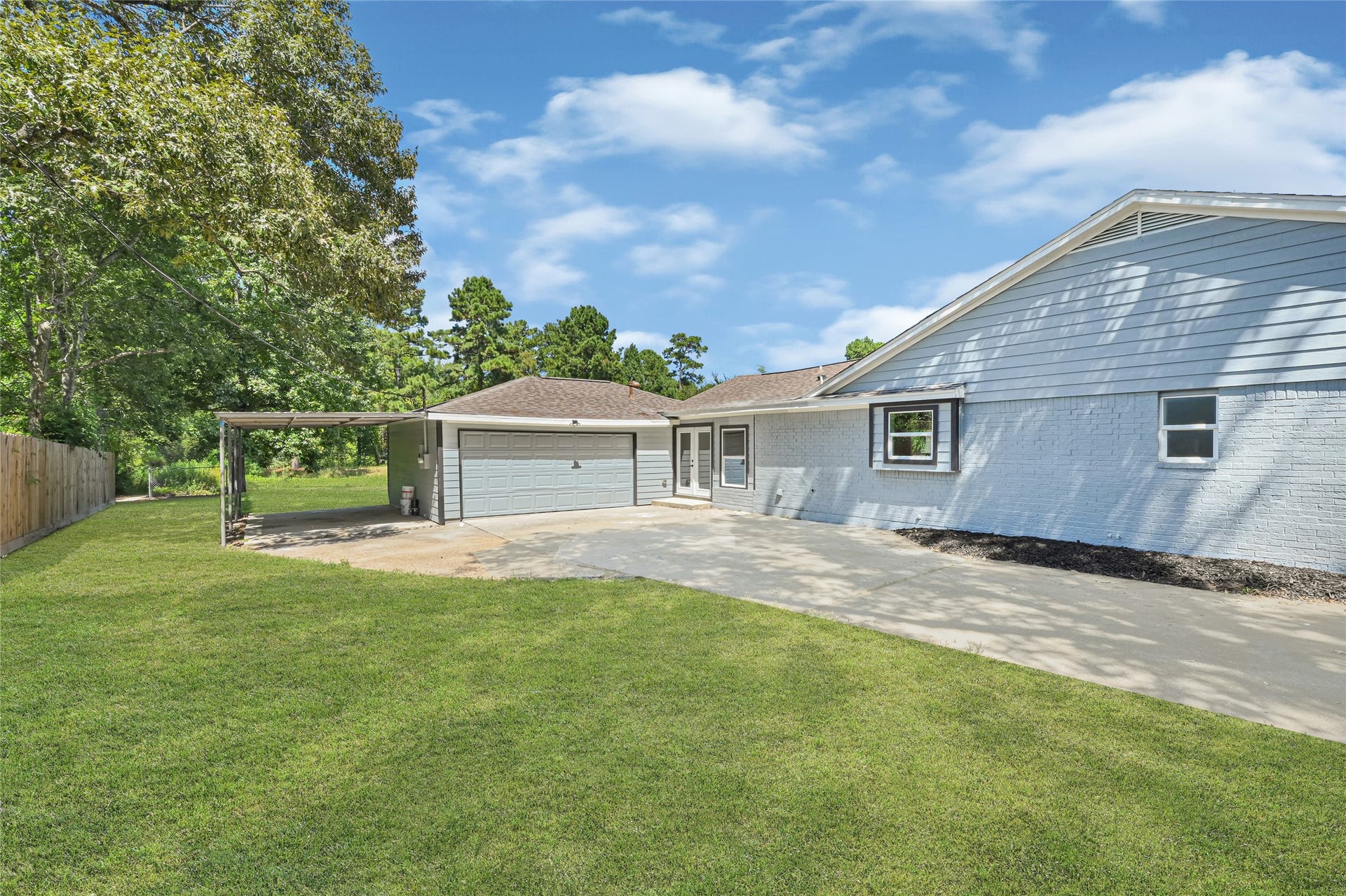 Plenty of room for parking with a 2 car garage and a carport