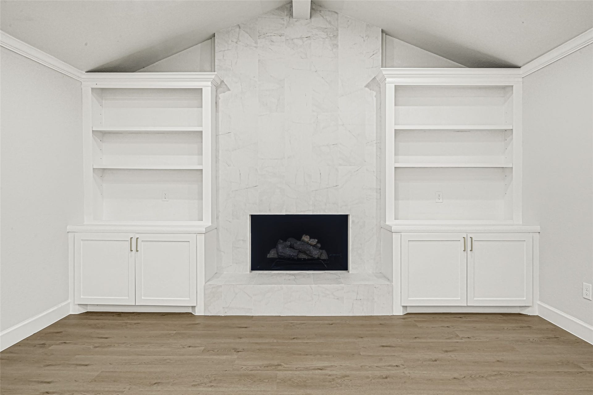 The beautiful fireplace serves as an elegant focal point of the living room