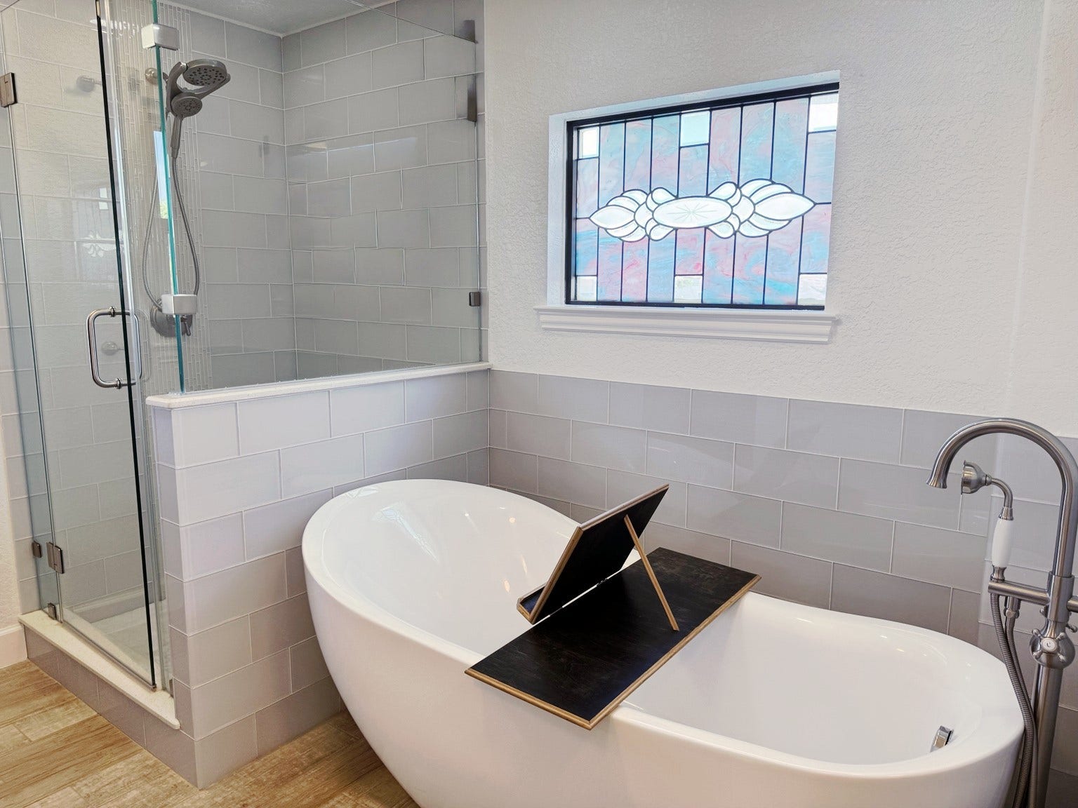 107 Bamaku Bend, Tiki Island, TX 77554 A freestanding tub and separate walk-in shower continue the spa-like experience, whether you prefer a leisurely soak or a refreshing shower.