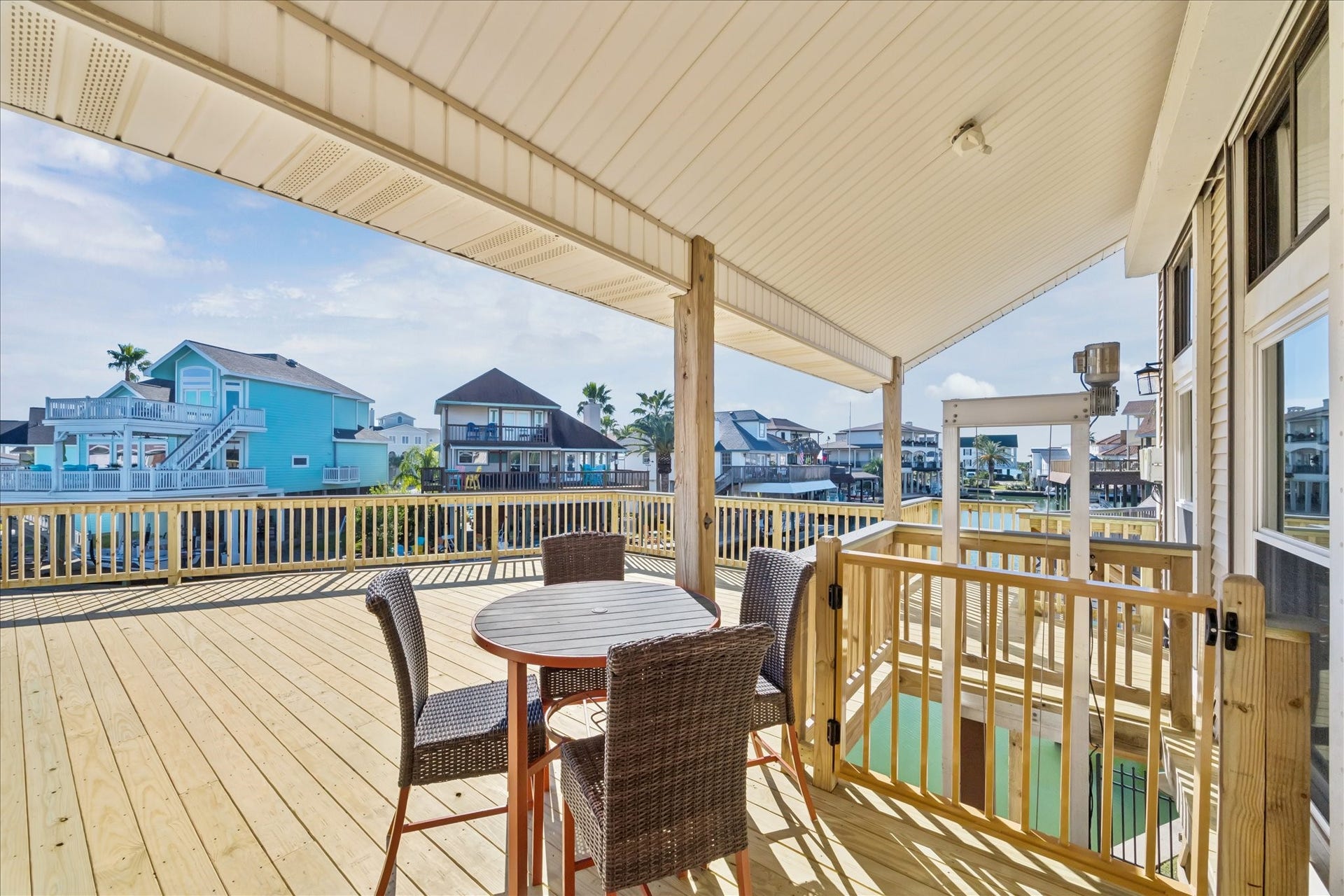 107 Bamaku Bend, Tiki Island, TX 77554 Multiple seating areas let you choose sun or shade while enjoying the sights, sounds and breezes of waterfront living. The covered lift beside the entry makes bringing up groceries effortless.