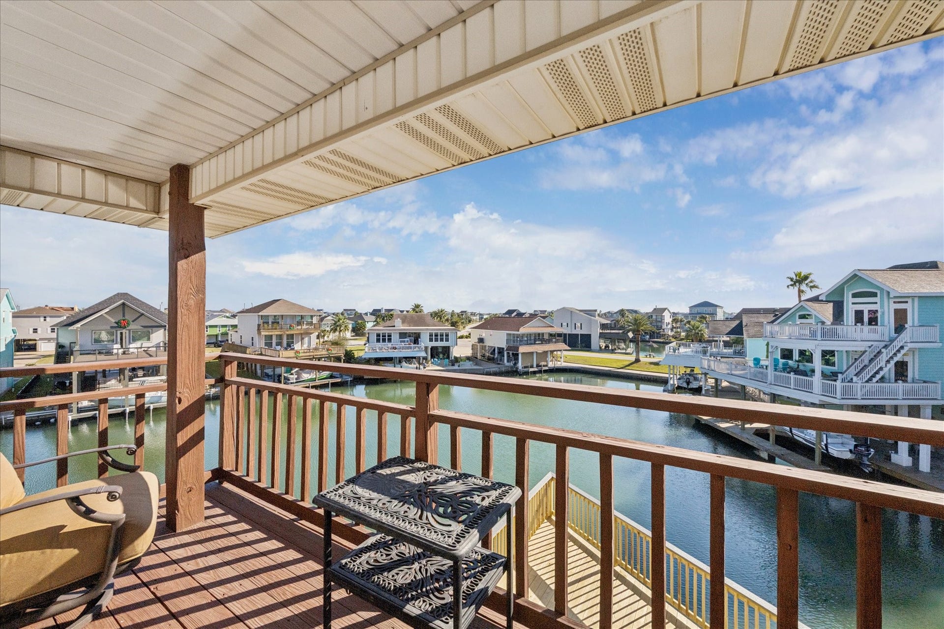 107 Bamaku Bend, Tiki Island, TX 77554 Step through French doors onto your private covered balcony, where sweeping sightlines stretch across the canals, with views extending all the way to Jones Bay. Unblocked by neighboring homes, it's perfectly positioned for watching the daily sunrise.
