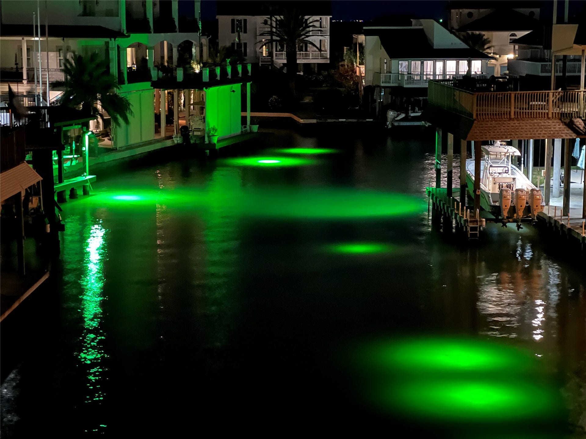 107 Bamaku Bend, Tiki Island, TX 77554 When the sun goes down, the waterfront takes on a whole new look. Underwater green lights illuminate the canal, attracting fish and creating a captivating view right from your deck.