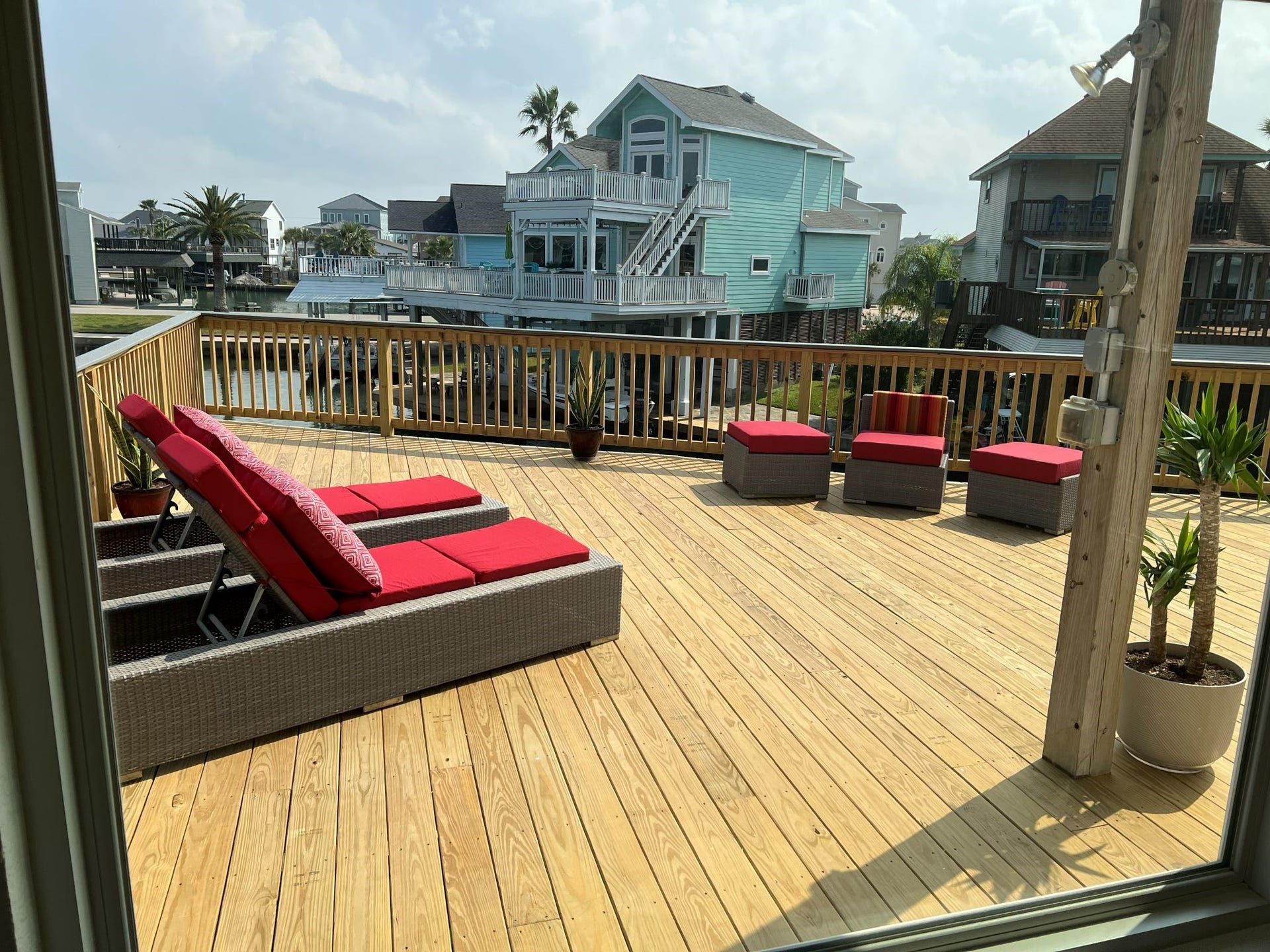 107 Bamaku Bend, Tiki Island, TX 77554 Water surrounds the deck on three sides, creating an immersive canal setting and front-row seat to the activity on the water.