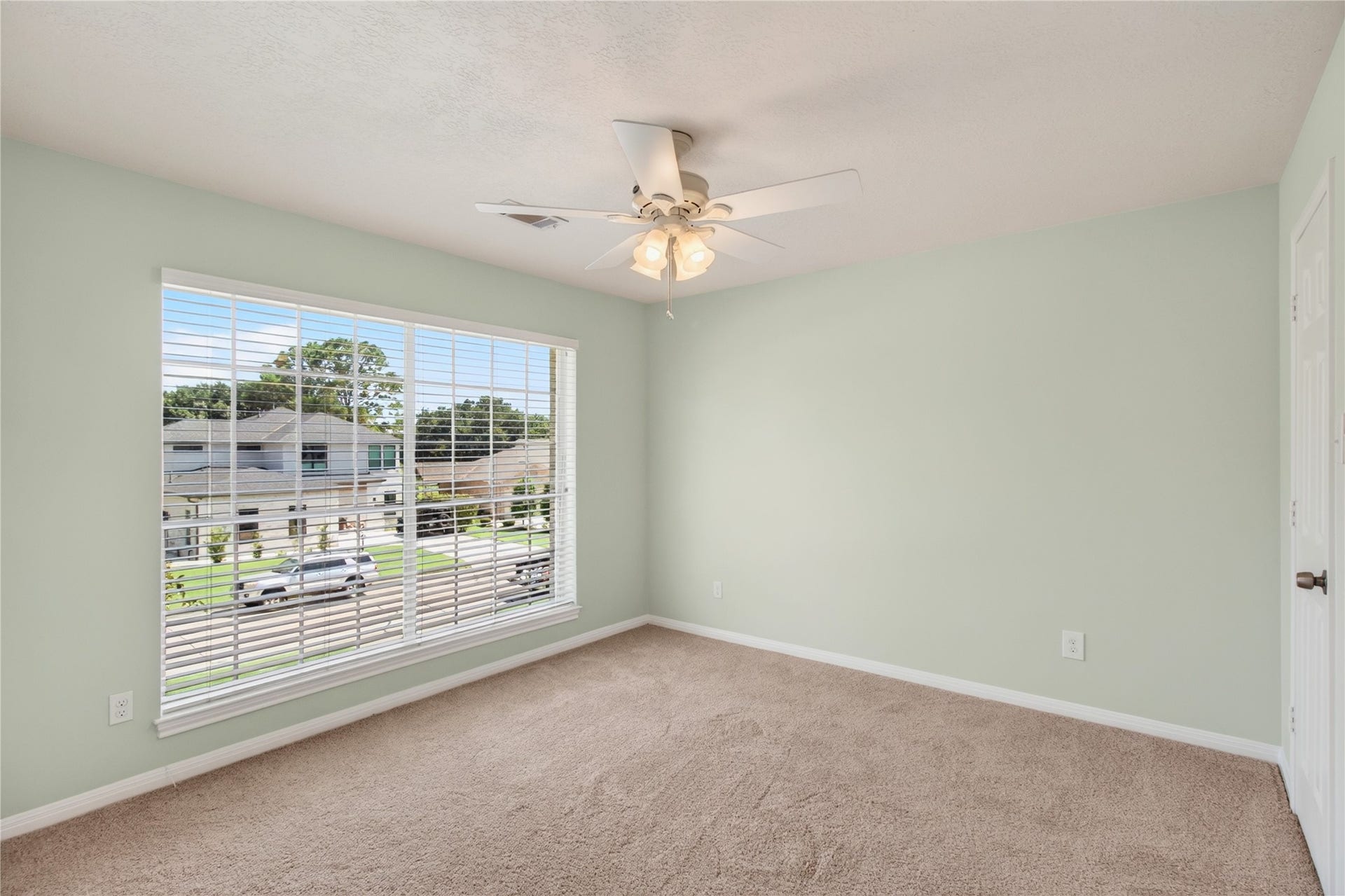 54 S Wind Drive, Montgomery, TX 77356 Upstairs there are oversized windows in this 14 x 14 bedroom for gorgeous natural light.
