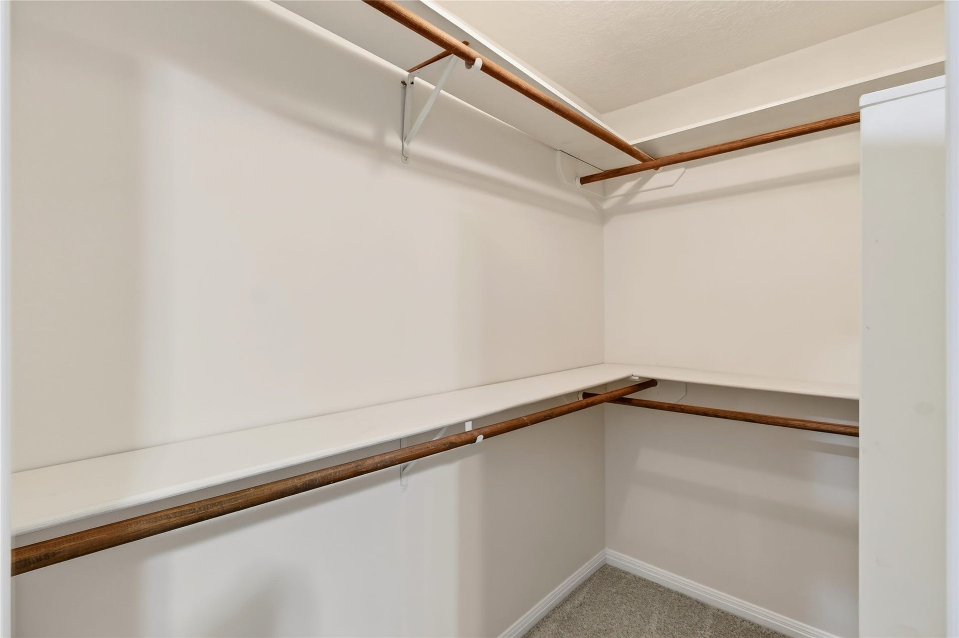 54 S Wind Drive, Montgomery, TX 77356 There are two large walk-in closets in the upstairs primary bathroom. Lots of space and shelving.