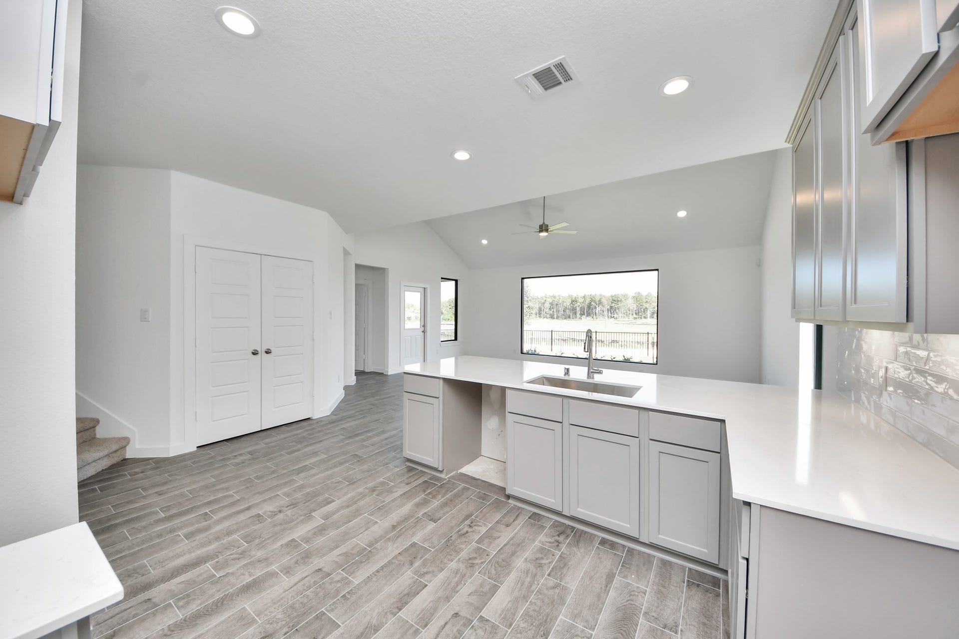 The open concept effortlessly connects the kitchen to the expansive family room, forming a perfect hub for gatherings. This seamless flow creates an inviting space where cooking and socializing come together harmoniously. Sample photo of completed home with similar floor plan. Actual colors and selections may vary.