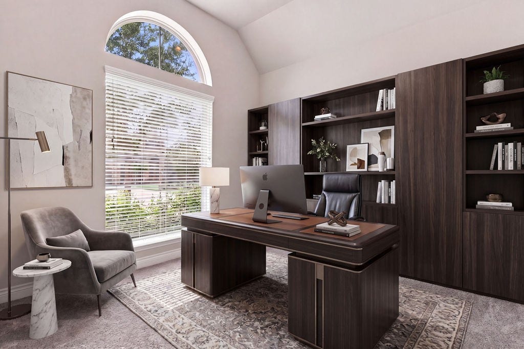 6914 Red Oak Drive, Katy, TX 77493 Elegant home office featuring a large arched window that fills the space with natural light, complemented by rich wood built-in shelves and a sophisticated desk setup.