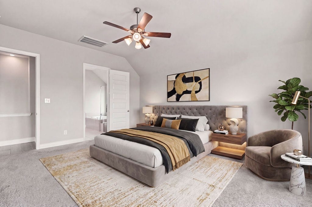 6914 Red Oak Drive, Katy, TX 77493 Elegant bedroom featuring a plush, upholstered bed, stylish nightstands, and a cozy seating area. Soft, neutral tones create a serene atmosphere, enhanced by modern artwork and ample natural light.