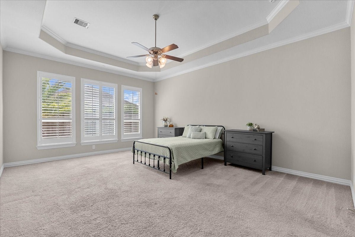 Plenty of room in this spacious primary suite for a cozy little sitting area as well.
