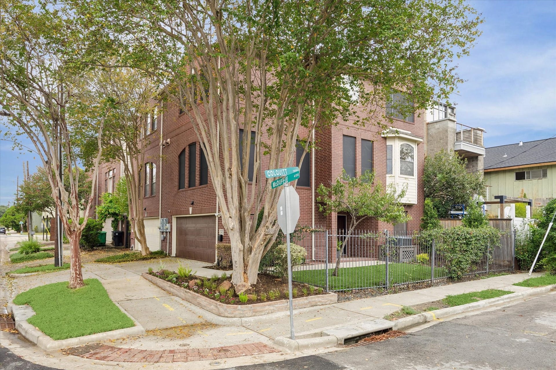4123 Mcduffie Street, Houston, TX 77098 Exterior shot showing front of townhome facing McDuffie and side yard facing Colquitt.