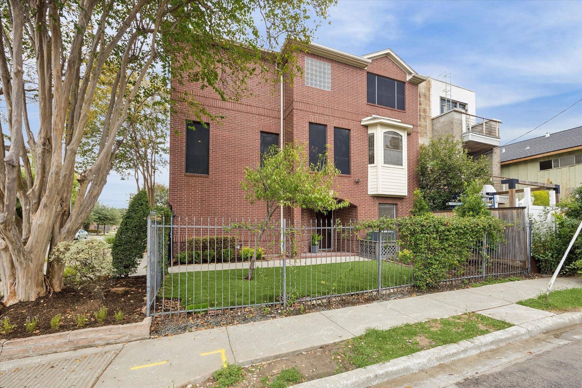 4123 Mcduffie Street, Houston, TX 77098 Corner three story brick townhome with fenced side yard great for kids or pets to play.