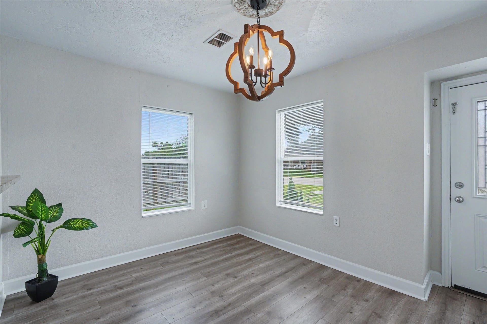 2523 7th Avenue N, Texas City, TX 77590 Light-filled flex space with two windowsideal for dining, a sitting area or home office.