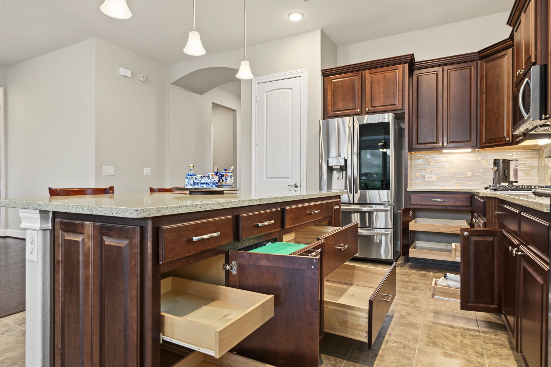 Kitchen is enhanced with pull out deep drawers