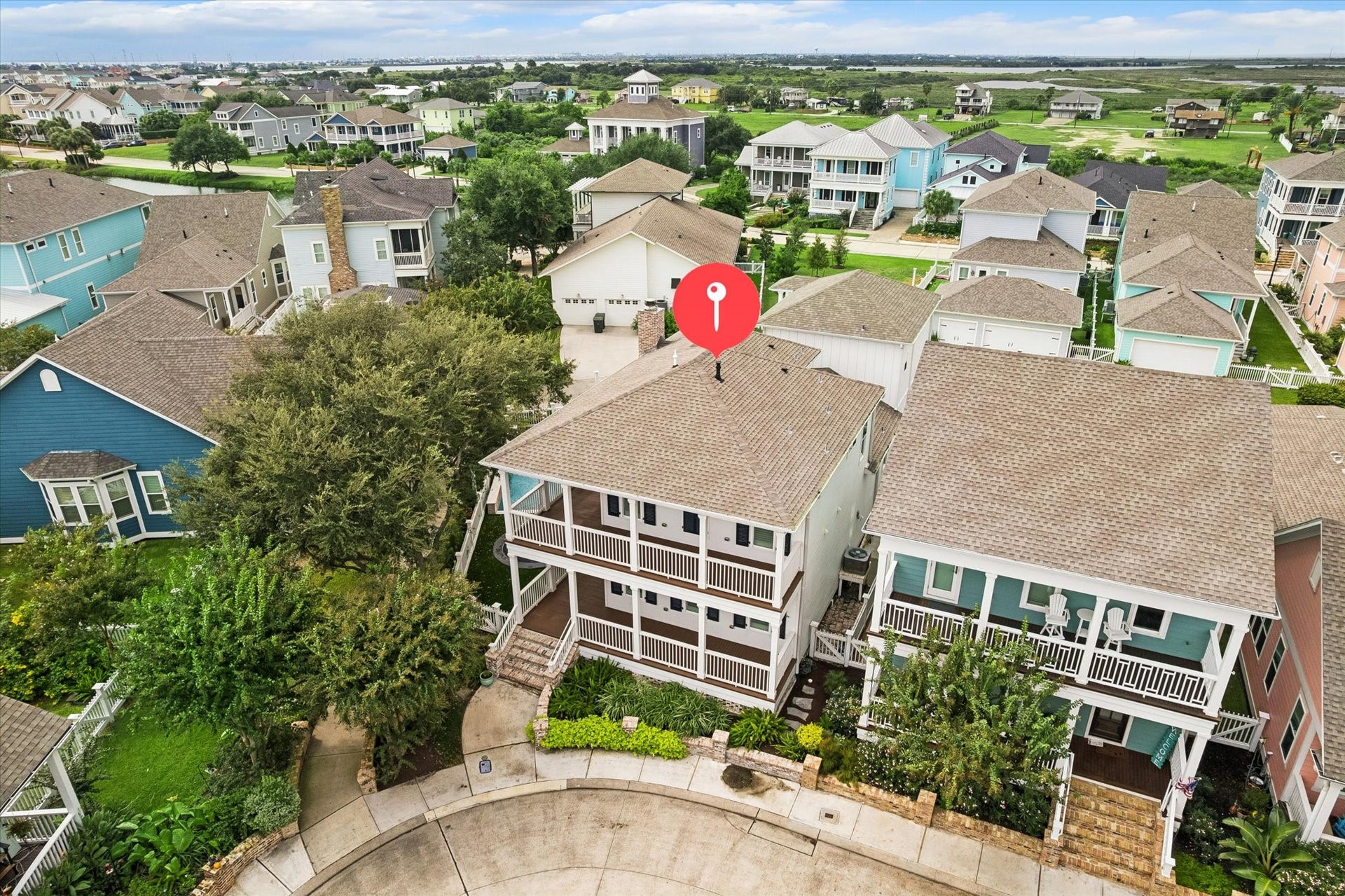 7 Curiosity Lane, Galveston, TX 77554 Drone of front profile