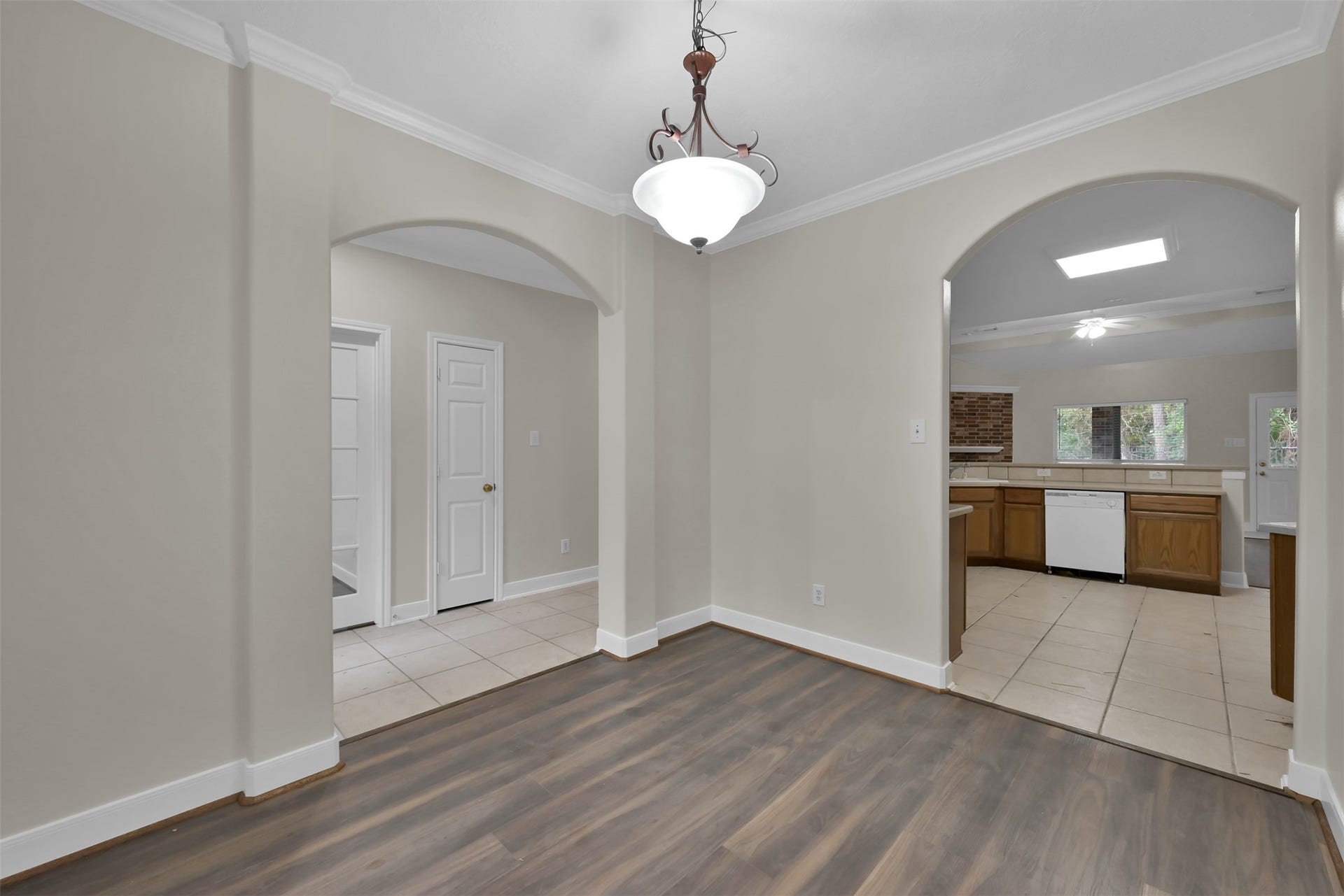 13425 Hidden Valley Drive, Montgomery, TX 77356 The Dining room is to the right upon entry. And a little view of the kitchen.