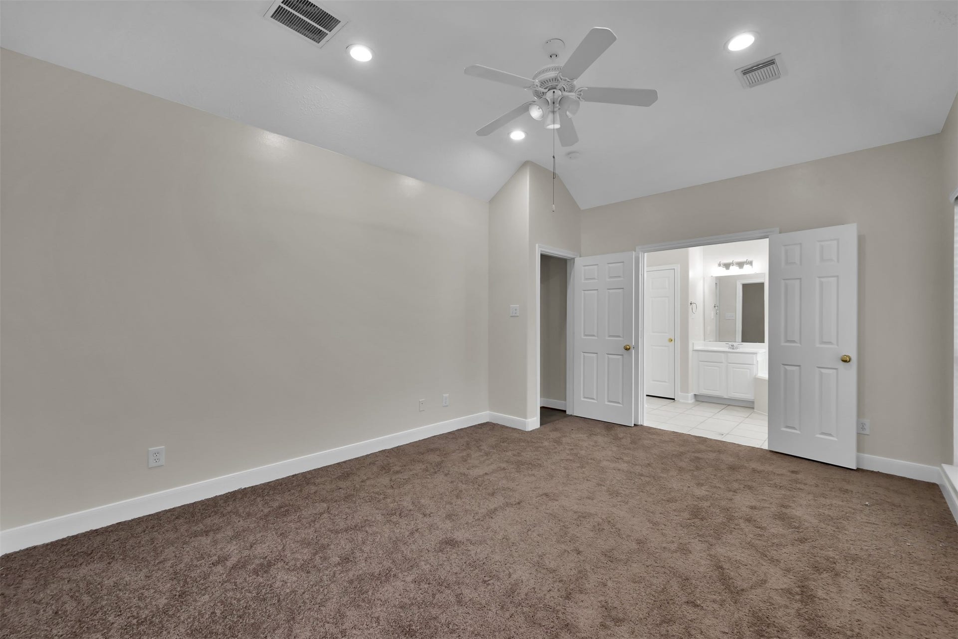 13425 Hidden Valley Drive, Montgomery, TX 77356 Primary Bedroom, ahead is the entrance to the Living room and the Primary Bath.