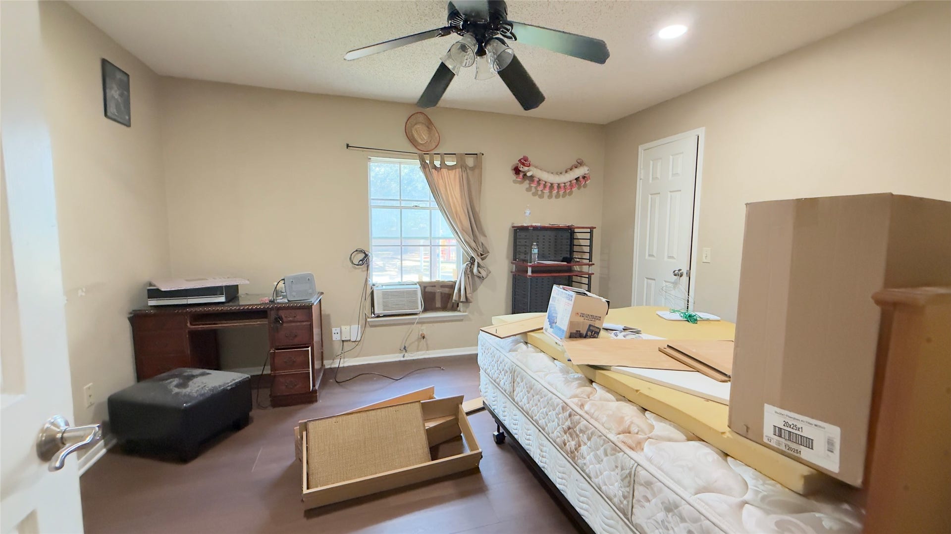 4119 King Cotton Lane, Missouri City, TX 77459 Cozy room #4 with natural light, featuring a ceiling fan, hardwood floors, and a convenient closet. Ideal for a home office or guest space.