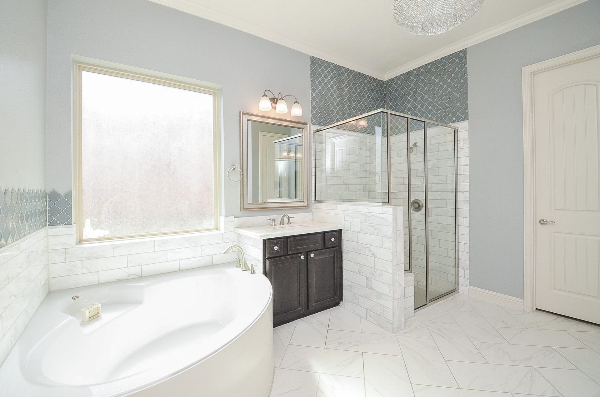 18438 Panton Terrace Lane, Cypress, TX 77429 Spacious master bathroom featuring a separate soaking tub and walk-in shower!