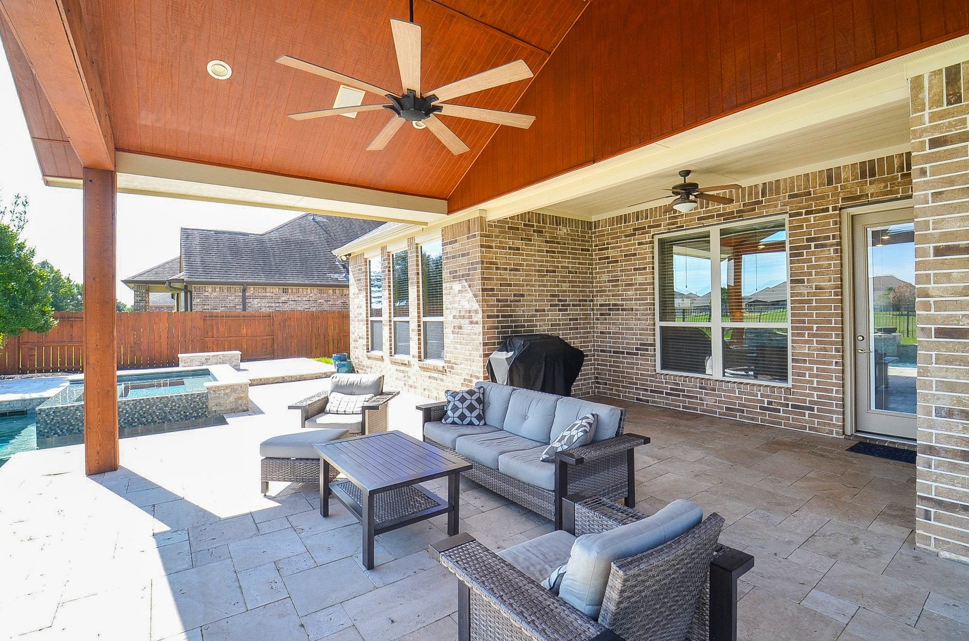 18438 Panton Terrace Lane, Cypress, TX 77429 Spacious backyard patio featuring stunning views of the pool and lake!