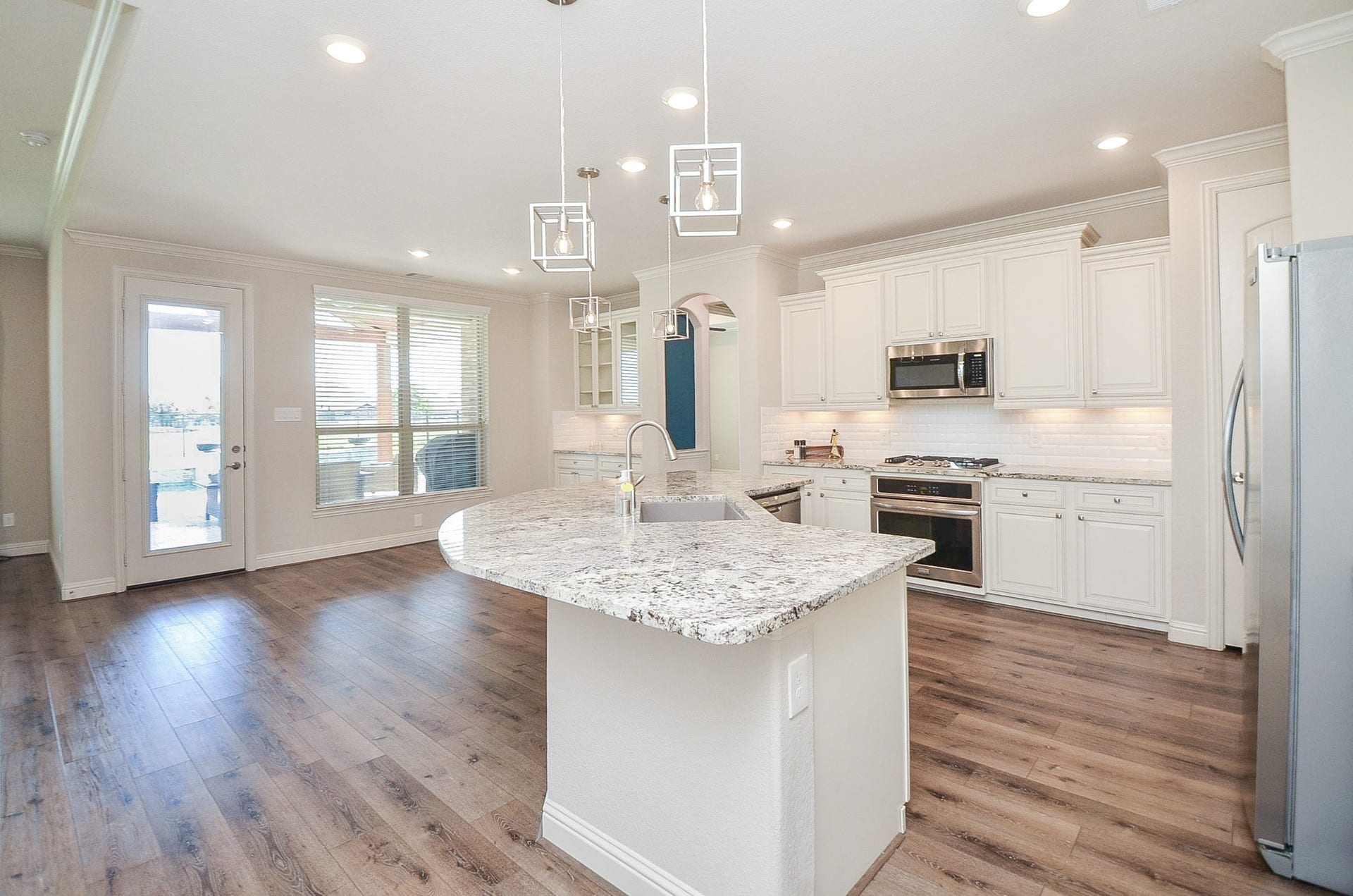 18438 Panton Terrace Lane, Cypress, TX 77429 This property features an inviting open floor plan with a breakfast bar that flows seamlessly into the living room!