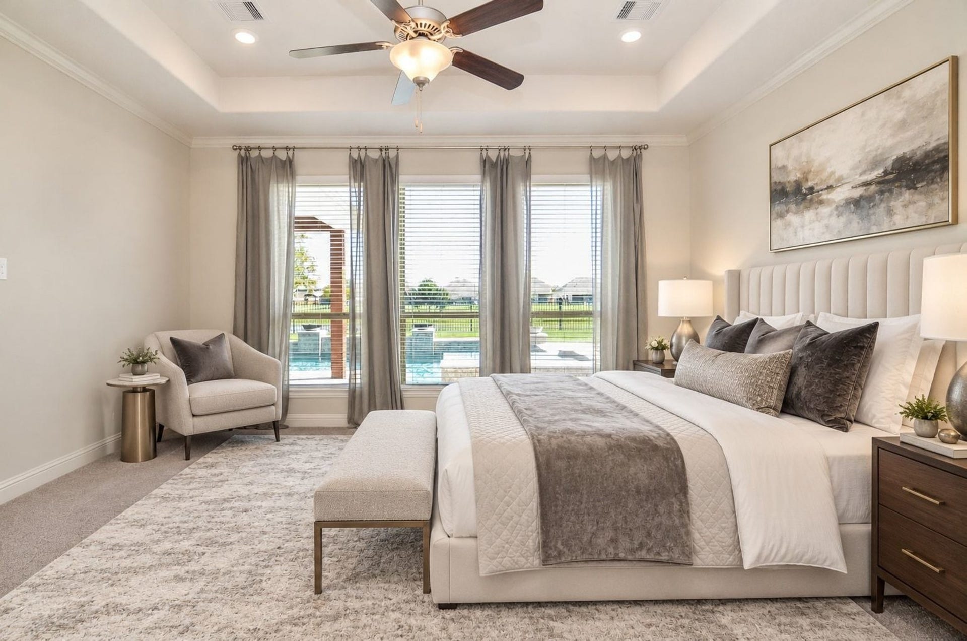 18438 Panton Terrace Lane, Cypress, TX 77429 Master bedroom featuring large windows with views of the pool and lake!
