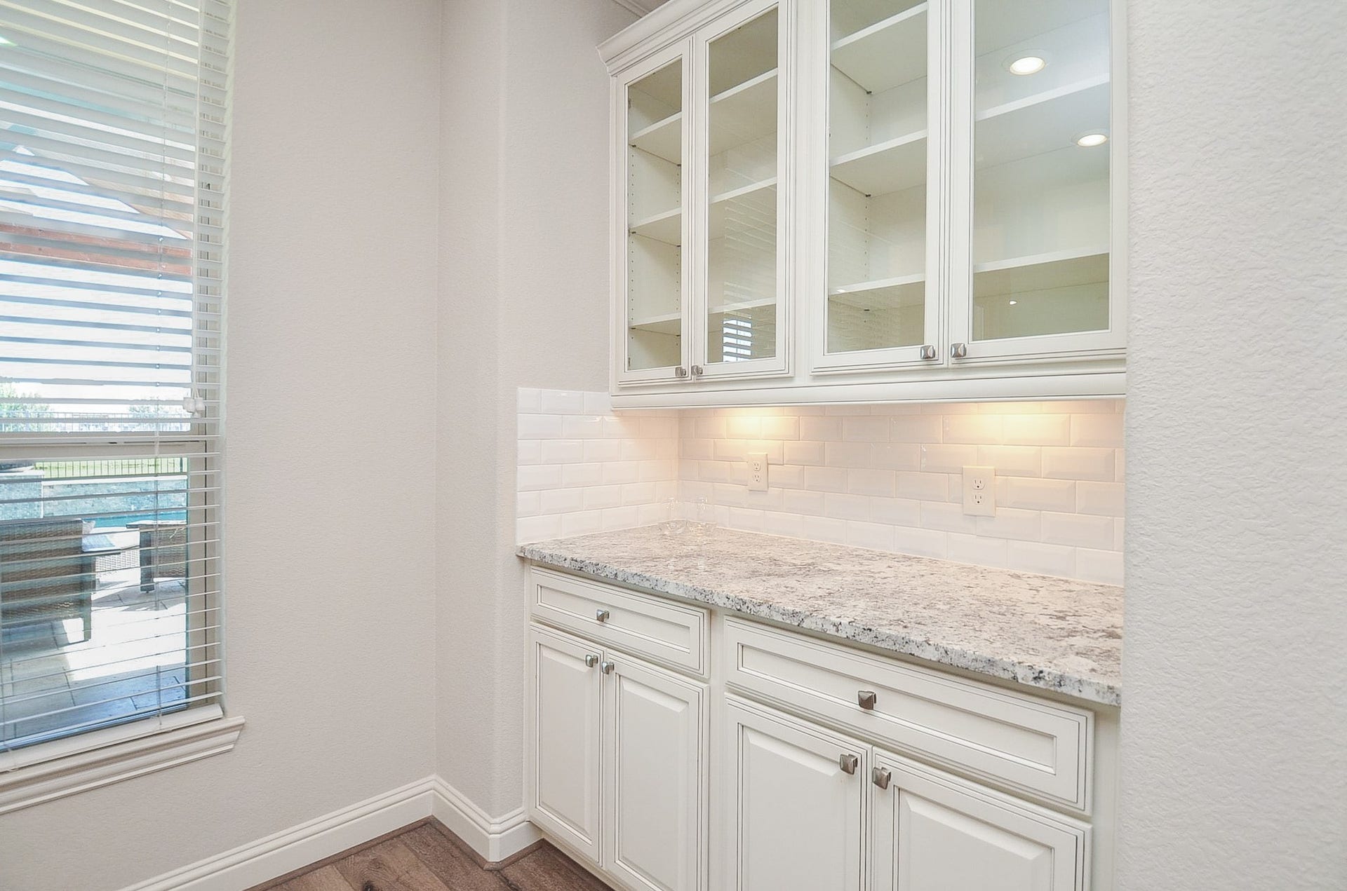 18438 Panton Terrace Lane, Cypress, TX 77429 Custom built-in cabinetry with elegant glass-front displays, perfect for showcasing your fine china and dinnerware!