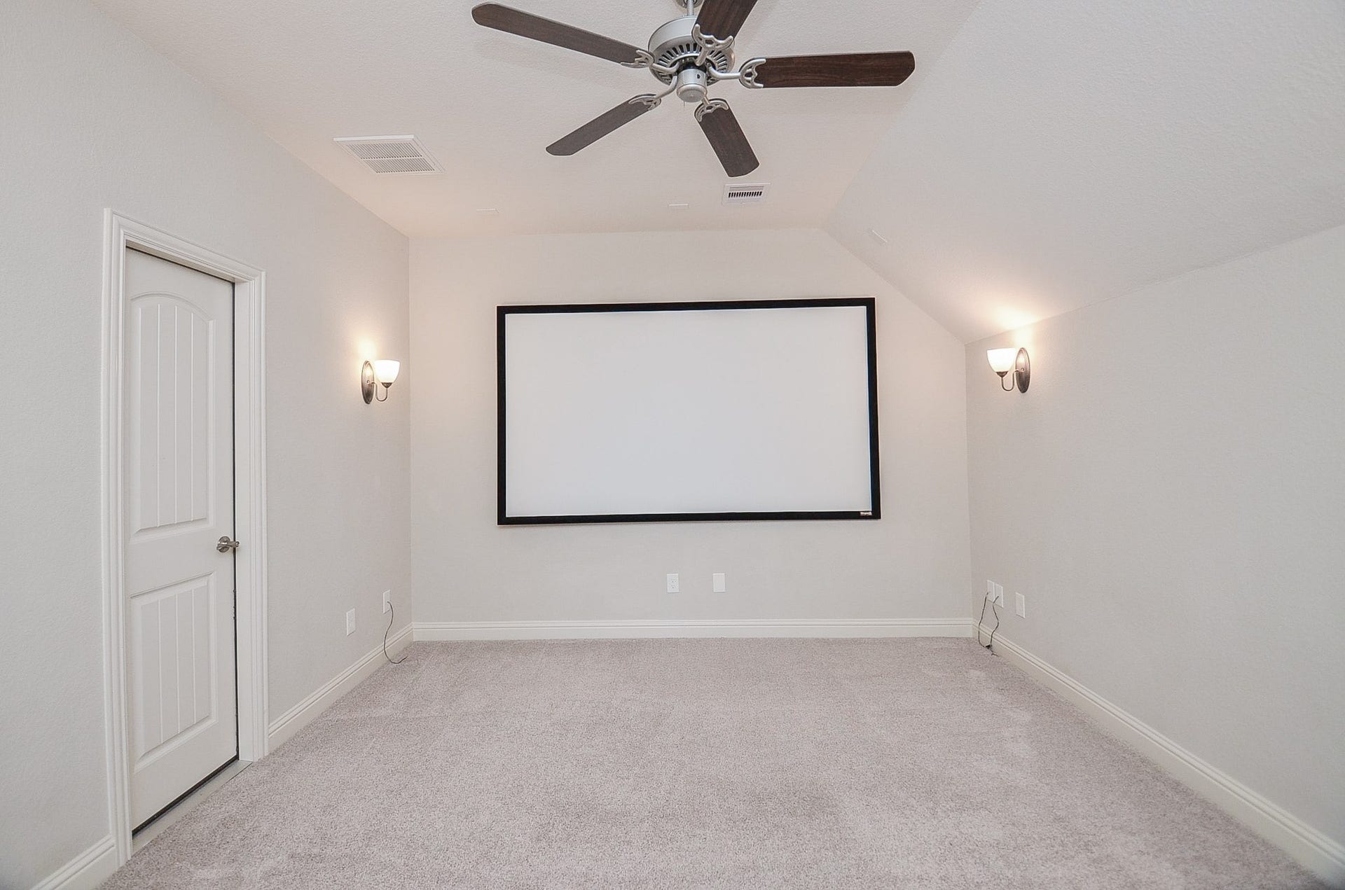 18438 Panton Terrace Lane, Cypress, TX 77429 Media room featuring a projector screen and room for professional-grade seating!