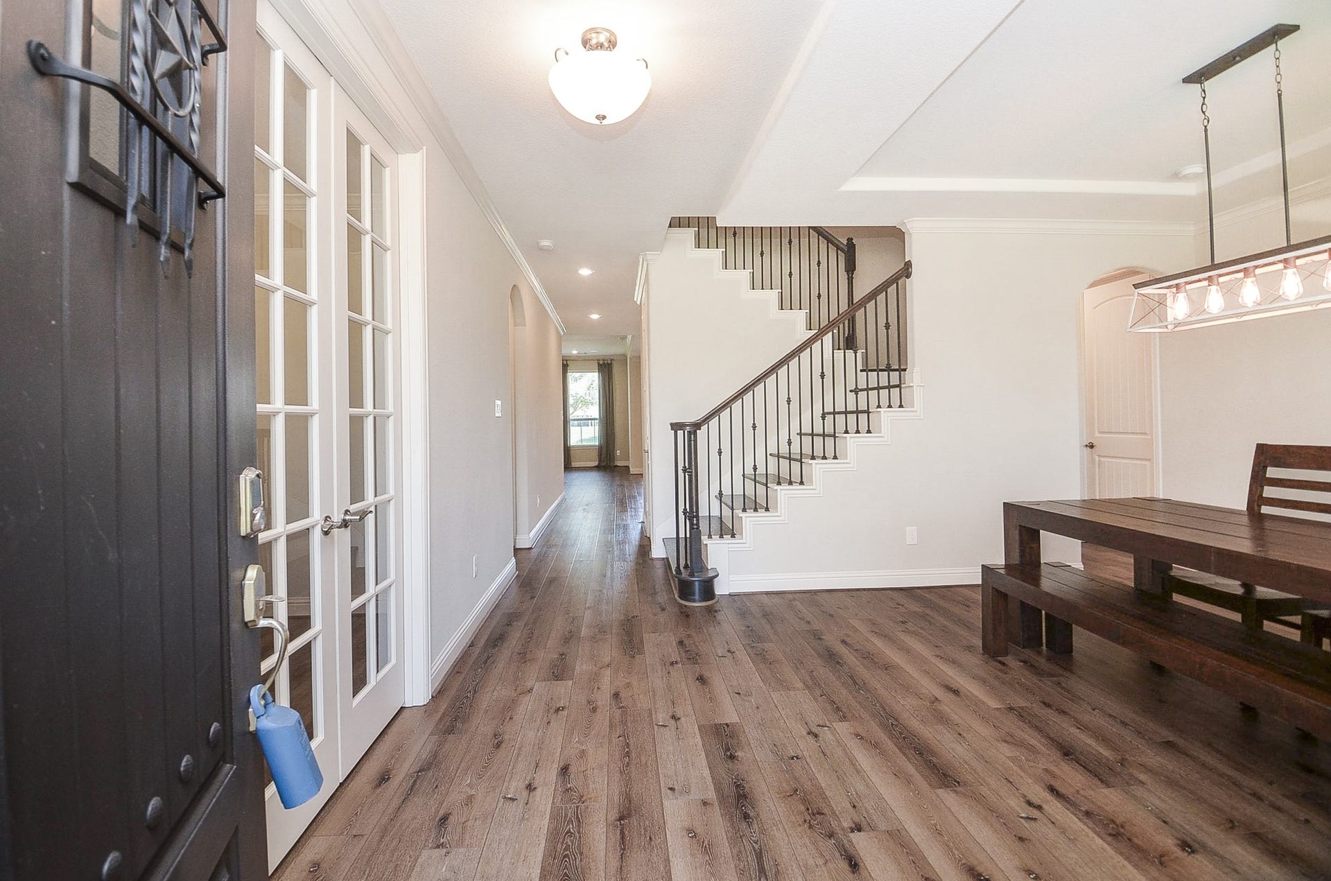 18438 Panton Terrace Lane, Cypress, TX 77429 Step through the beautiful front door into a grand entrance featuring a stunning iron stairwell!
