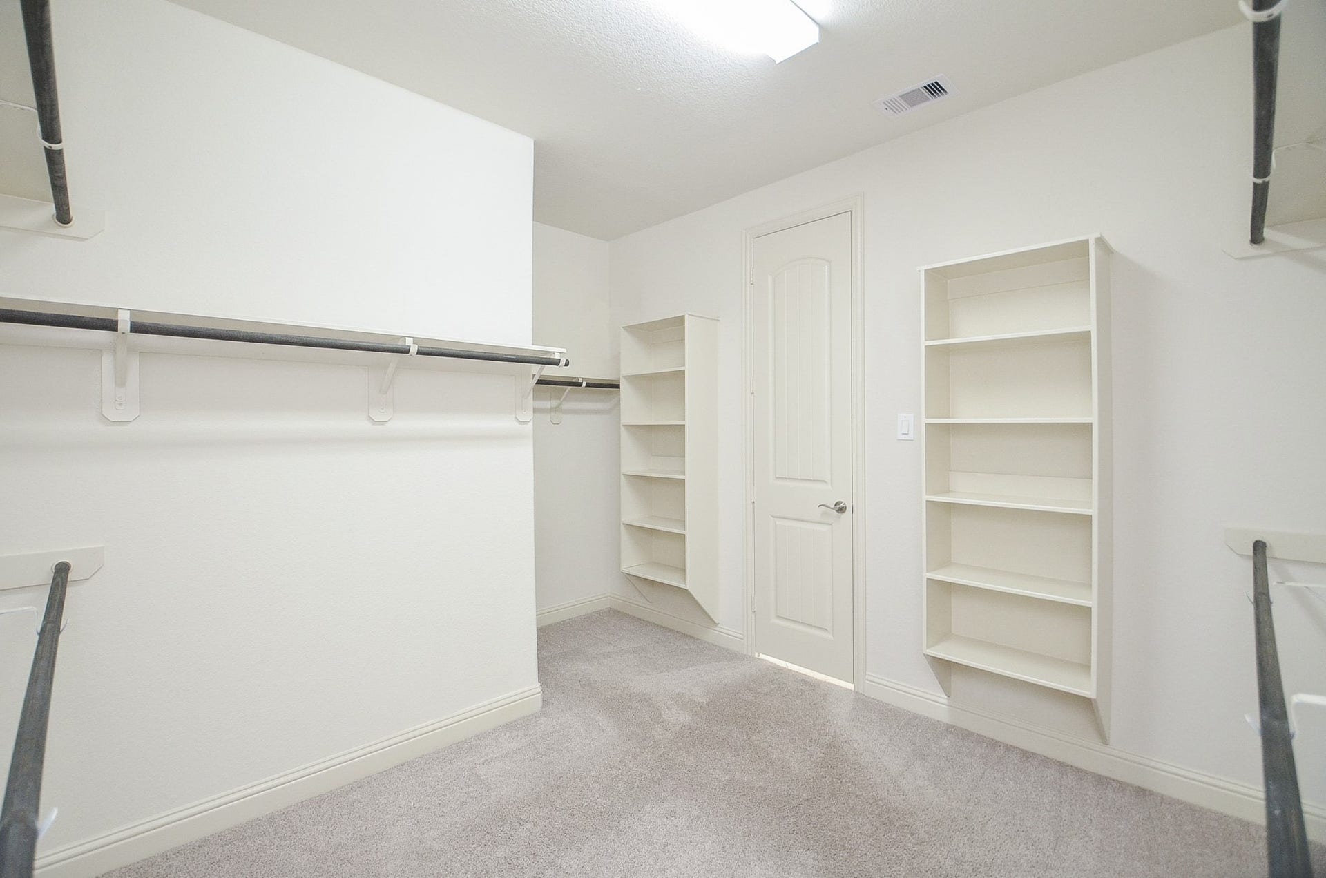 18438 Panton Terrace Lane, Cypress, TX 77429 Spacious walk-in closet with custom shelving and ample storage space!
