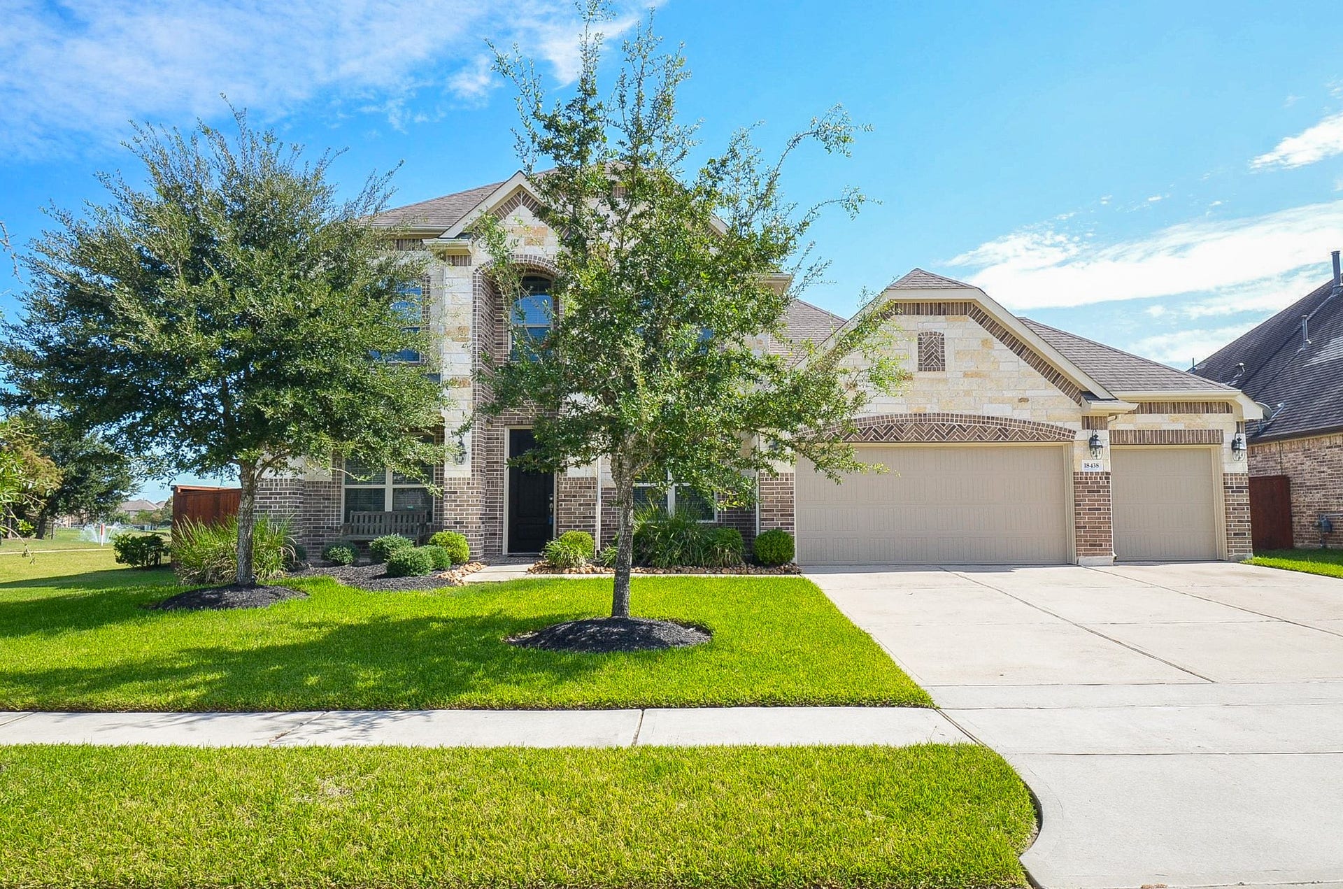 18438 Panton Terrace Lane, Cypress, TX 77429 This property features a spacious 3-car garage, providing ample storage and secure parking, complemented by an extensive driveway and additional paved areas that offer plenty of extra room for hosting friends, family, and guests!