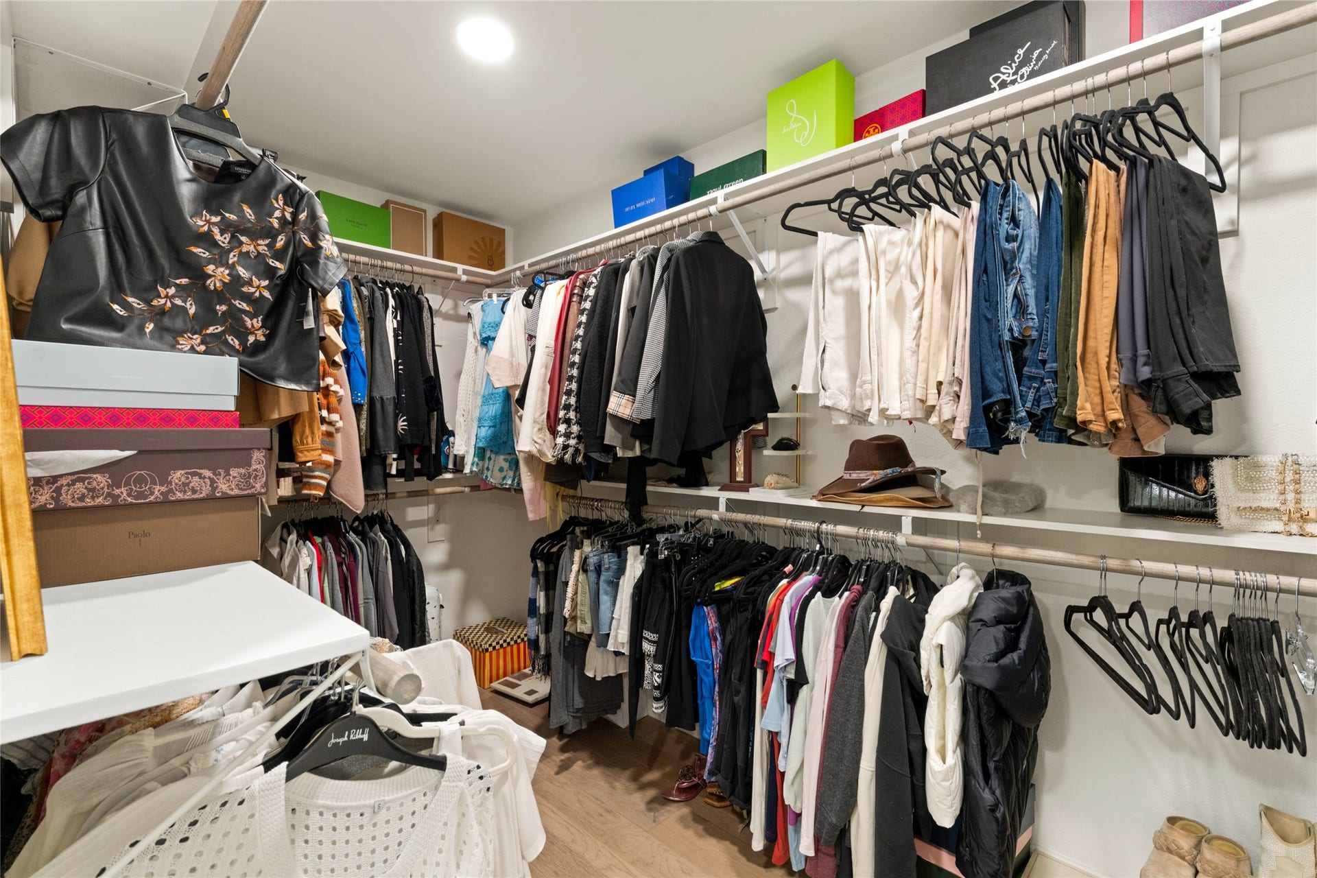 14 Lush Meadow Place, The Woodlands, TX 77381 Generous walk-in closet with double hanging rods and shelving for organized storage.