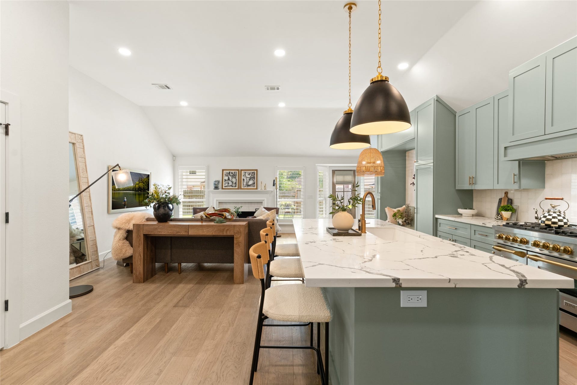 14 Lush Meadow Place, The Woodlands, TX 77381 The island offers additional workspace and casual seating, making it easy to stay connected with everyone in the living room. Every detail feels thoughtfully chosen.