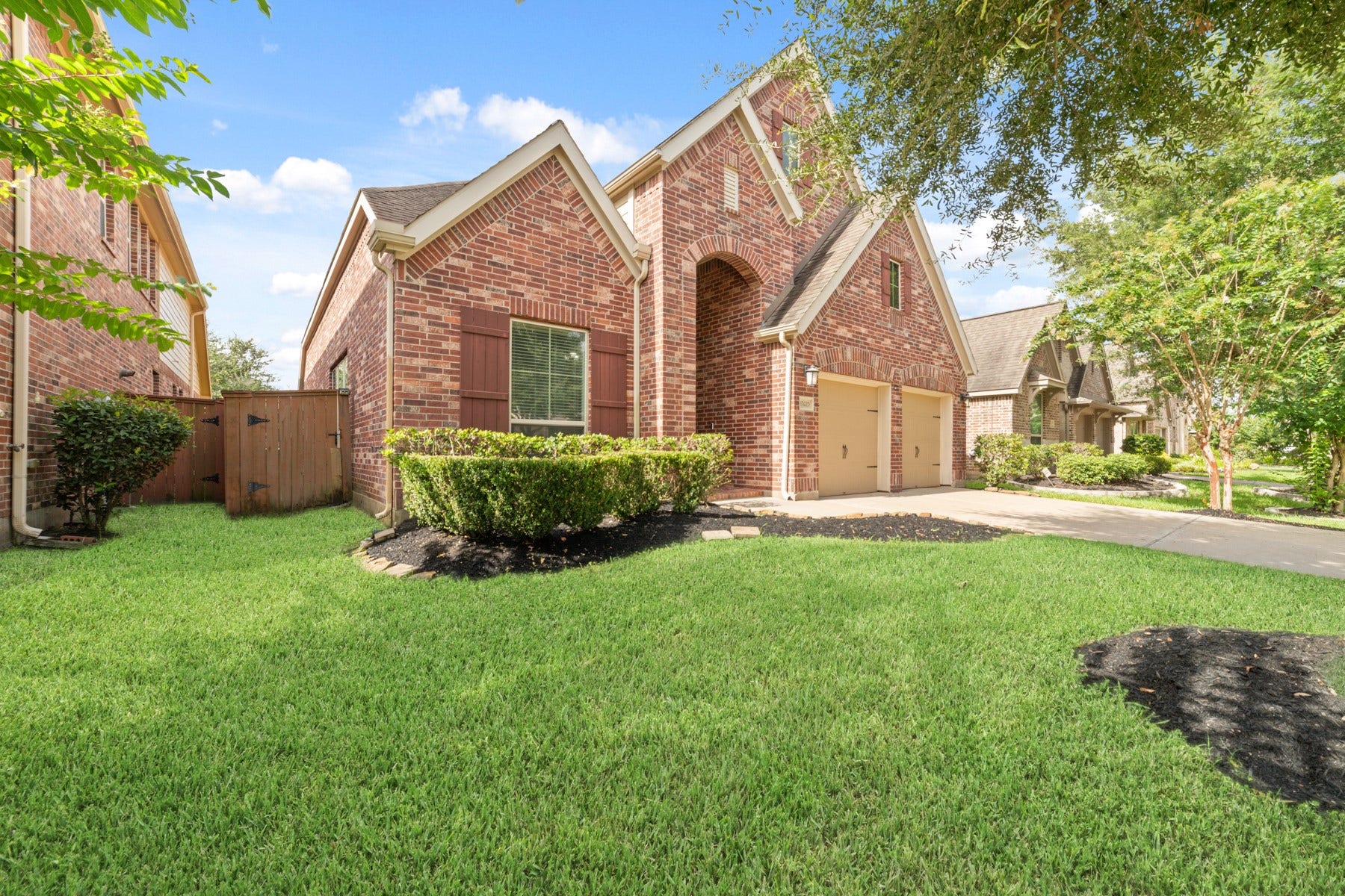 This home boasts a two-car garage and a spacious driveway.