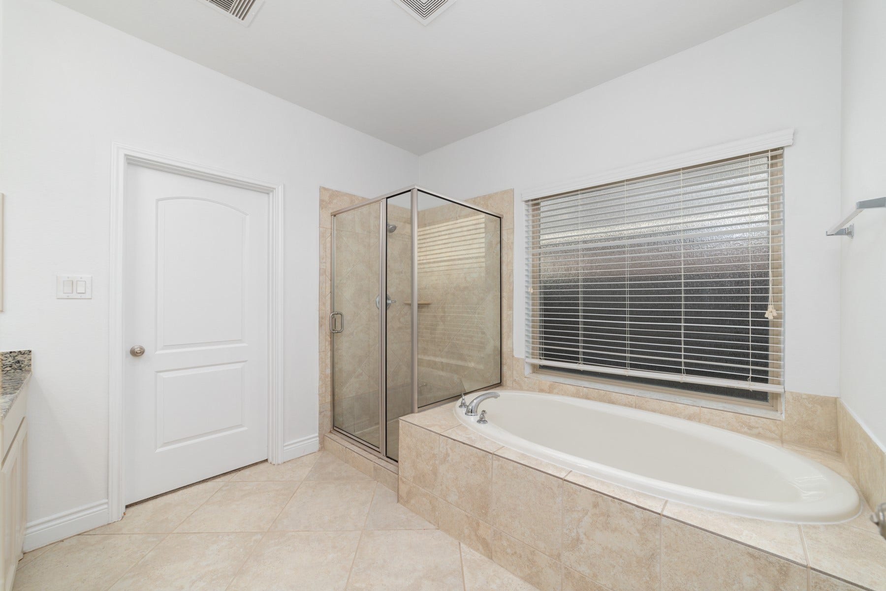 Indulge in relaxation with an elegant elongated soaking tub.