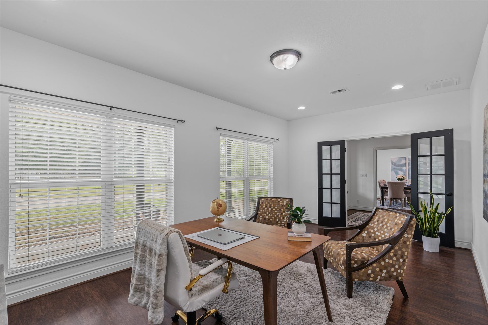 16144 Firetower Road, Conroe, TX 77306 Black French doors add character to the home office and provide the option to close off the space for added privacy while working or studying.