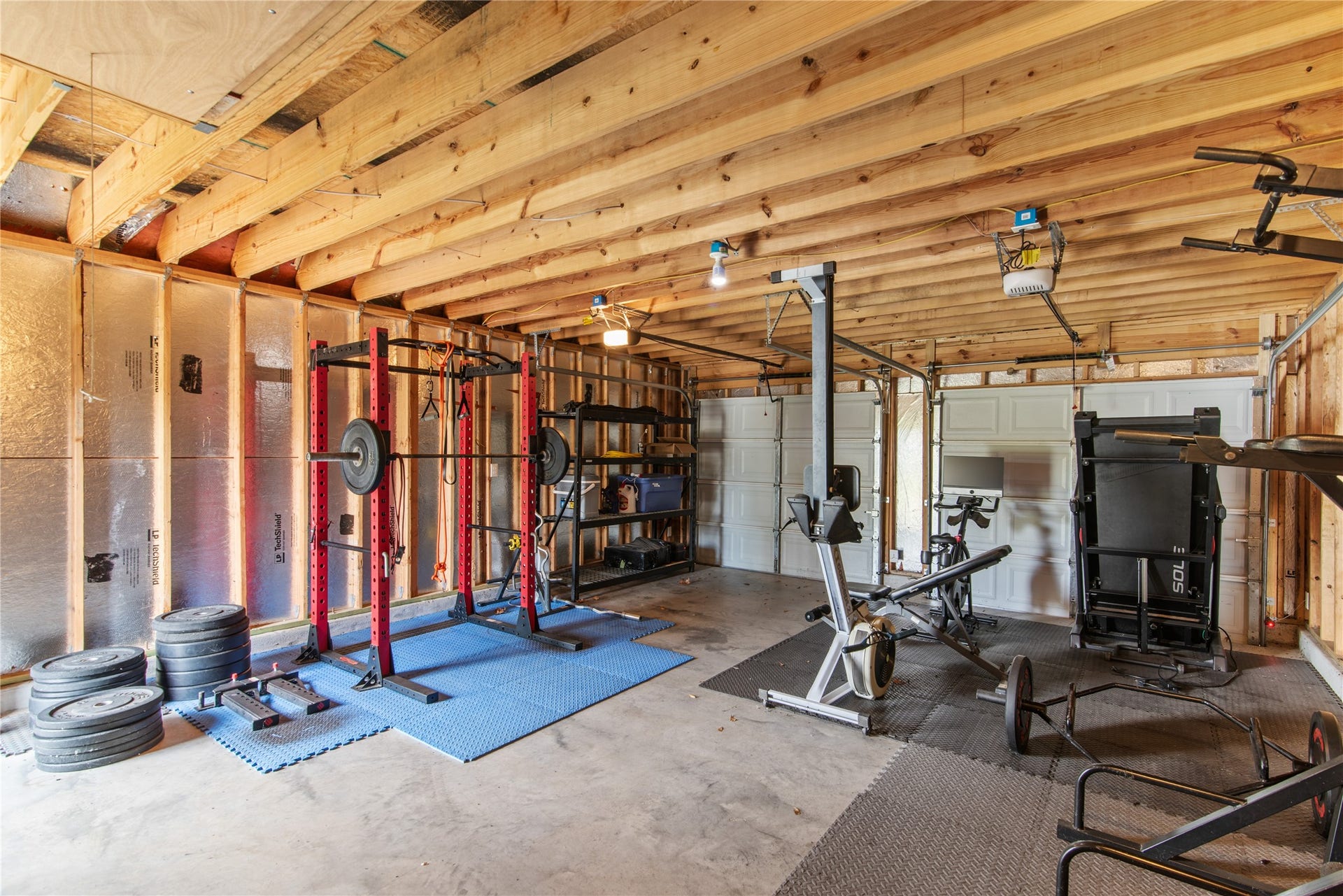 16144 Firetower Road, Conroe, TX 77306 Detached two-car garage currently used as a home gym, offering flexible space for fitness, hobbies, or vehicle parking.