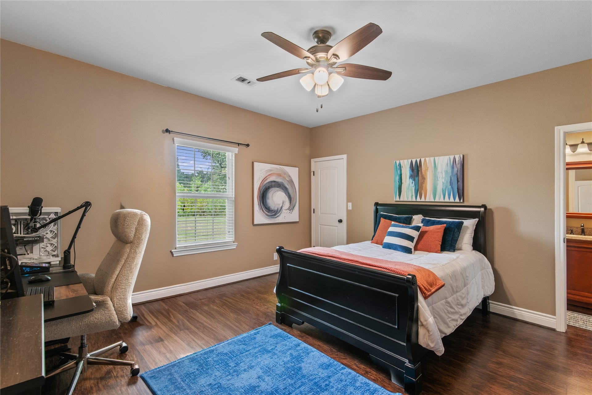 16144 Firetower Road, Conroe, TX 77306 Spacious secondary bedroom with a walk-in closet, room for a desk, and direct access to the Jack-and-Jill bathroom shared with the adjoining bedroom.