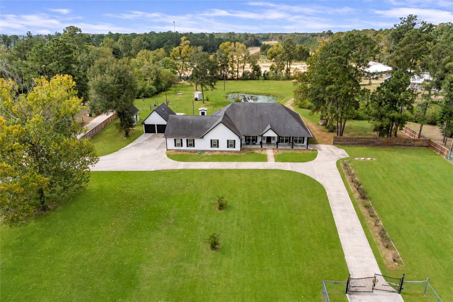 16144 Firetower Road, Conroe, TX 77306 Welcome to 16144 Firetower Rd! Situated on 1.77 acres, this spacious single-story home offers an expansive lawn, mature trees, and peaceful views of a neighboring pond.