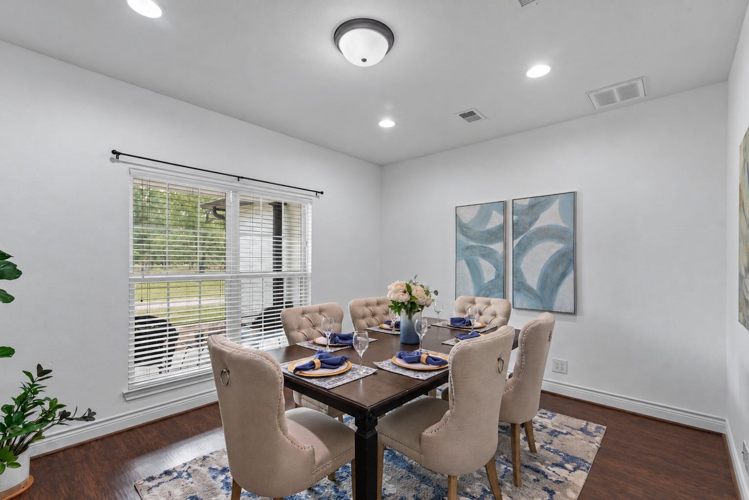 16144 Firetower Road, Conroe, TX 77306 Versatile room currently staged as a formal dining area, with space to gather for meals and the flexibility to serve as a second home office.
