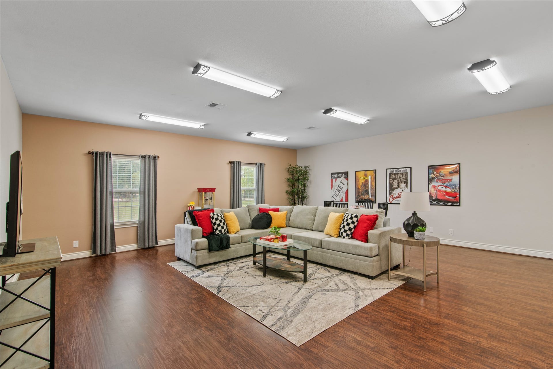 16144 Firetower Road, Conroe, TX 77306 Oversized fourth bedroom, currently staged as a game room, with ample space for a large sectional, movie nights, and recreation.