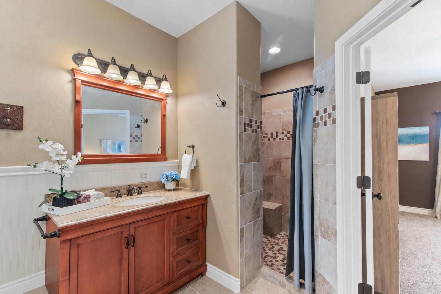 16144 Firetower Road, Conroe, TX 77306 A separate tiled shower and private toilet area add convenience to the thoughtfully arranged primary bath.