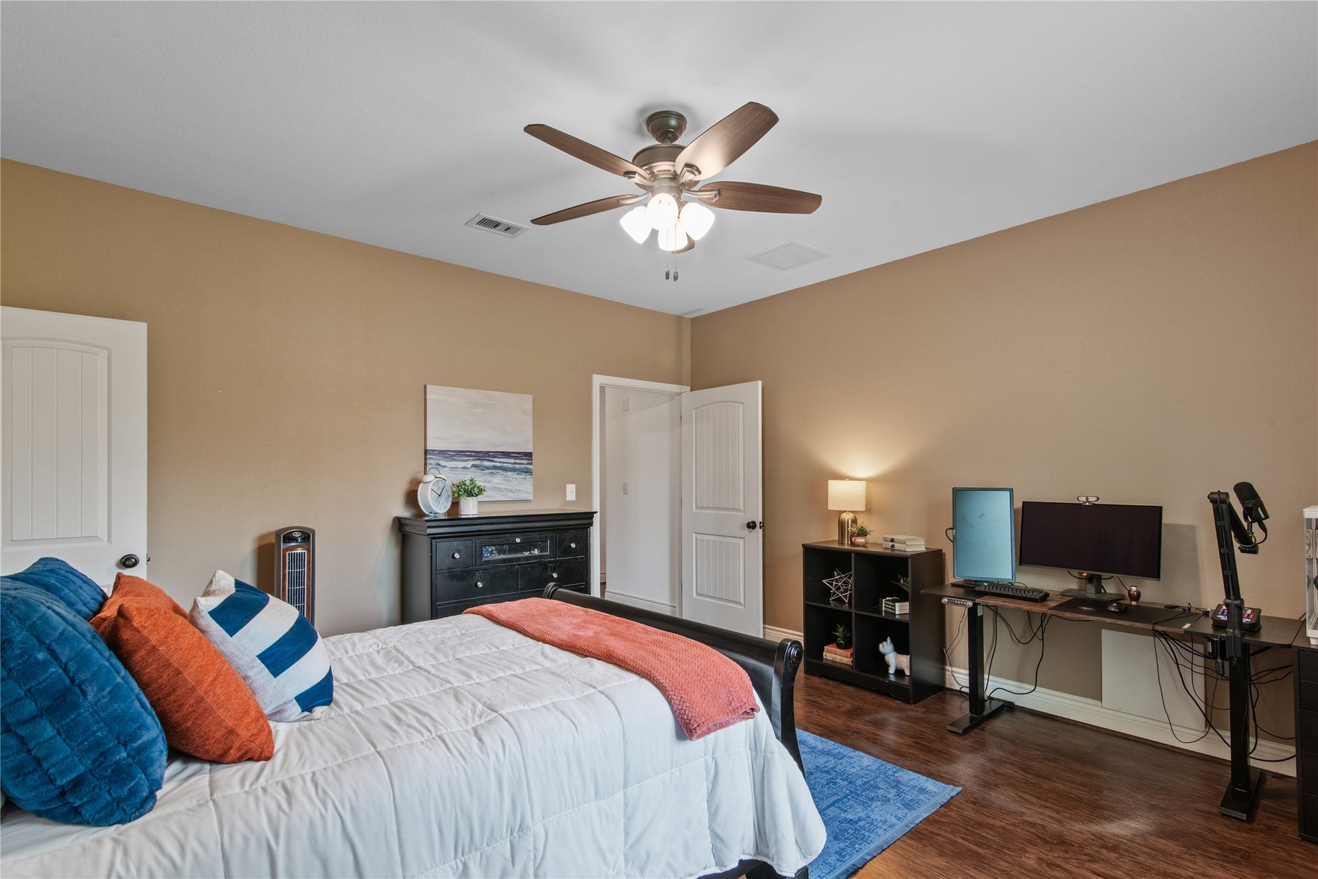 16144 Firetower Road, Conroe, TX 77306 An alternate view highlights the bedrooms generous layout, with space for a dedicated workstation and additional furniture.