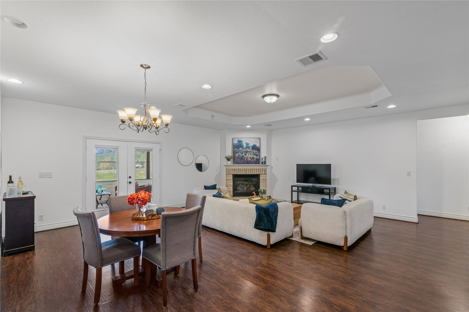 16144 Firetower Road, Conroe, TX 77306 The open layout connects the breakfast area and family room, with double glass doors leading to the sunroom for additional space to relax and entertain.