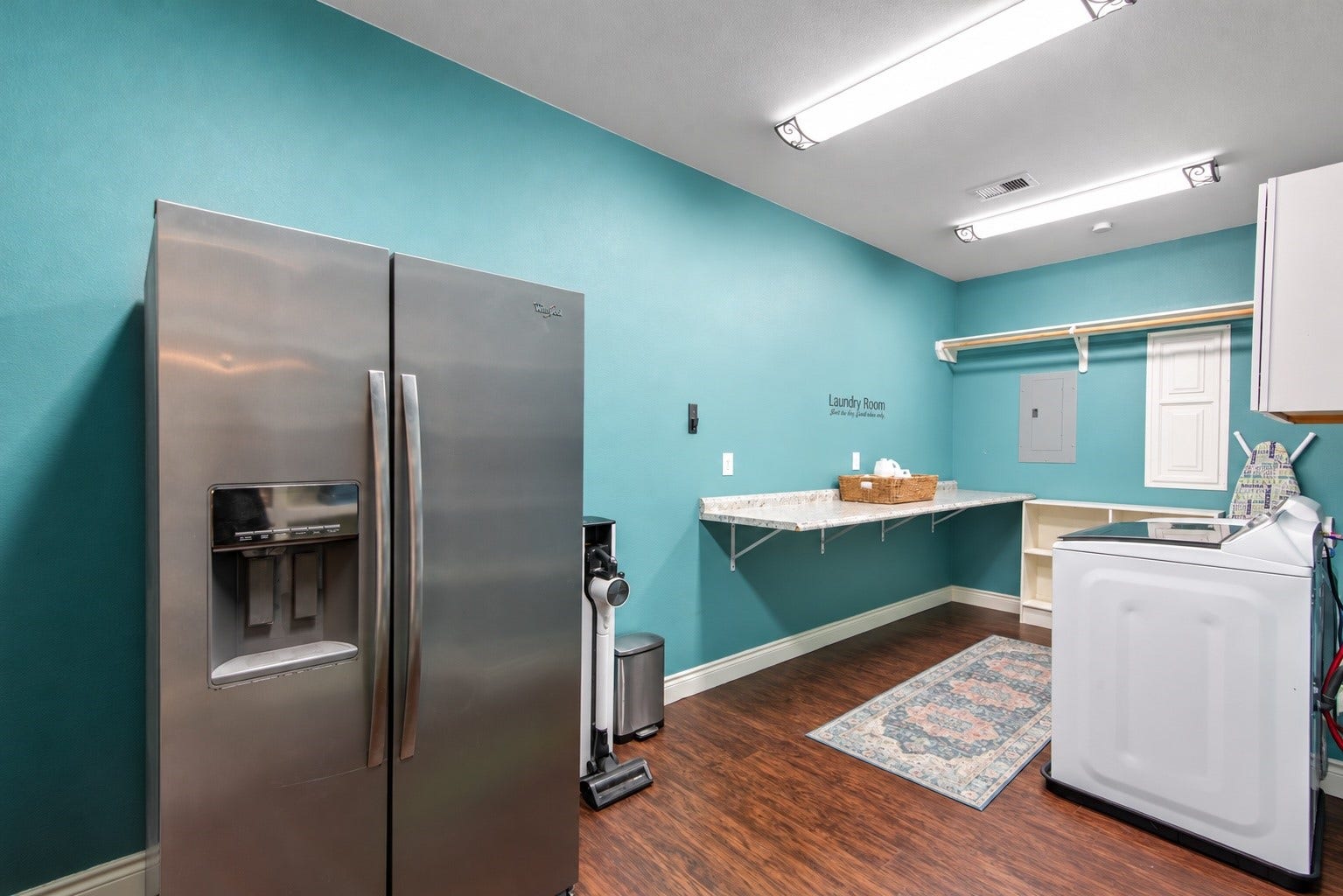 16144 Firetower Road, Conroe, TX 77306 A generous counter space provide a handy area for laundry tasks, with additional room for a second refrigerator.