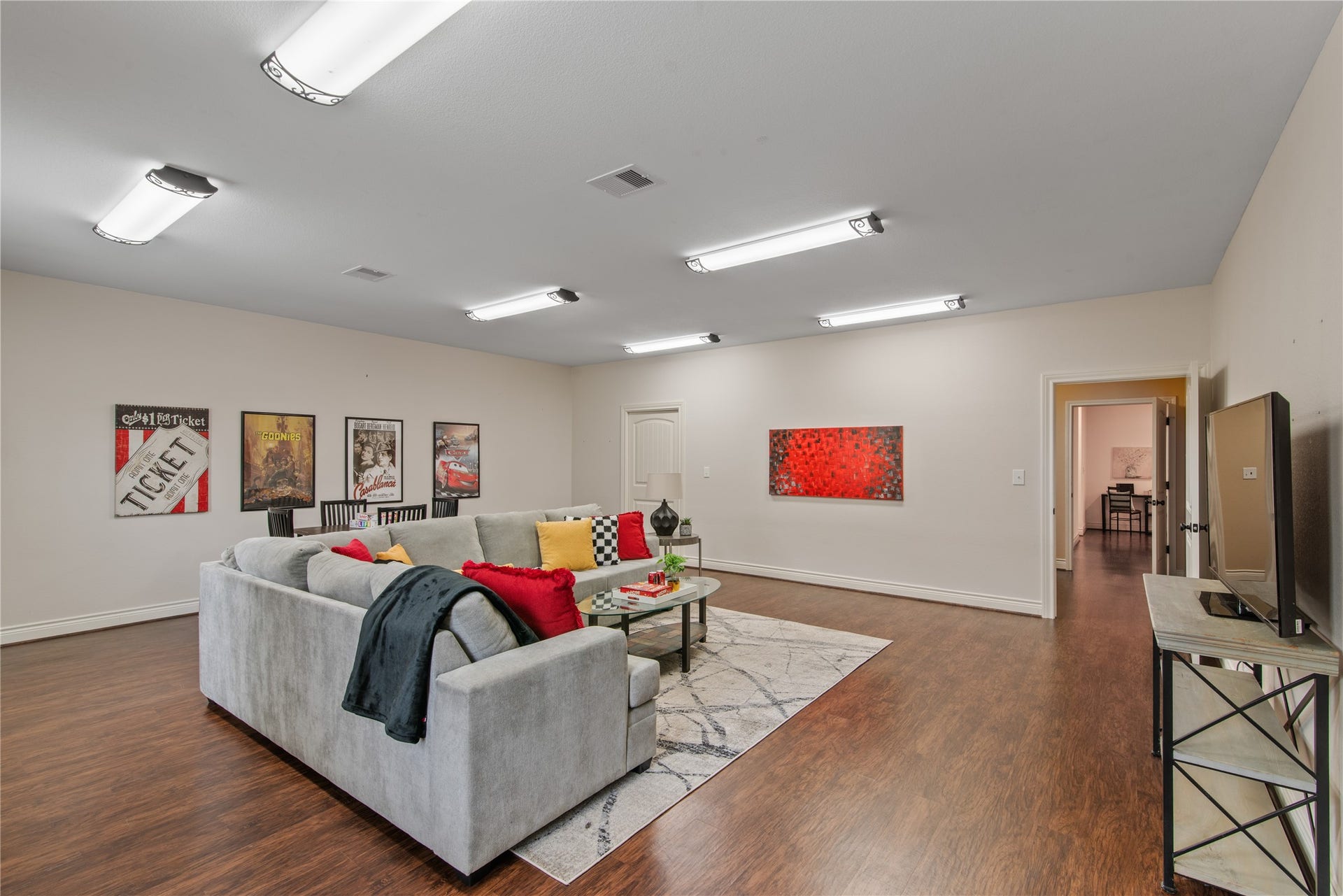 16144 Firetower Road, Conroe, TX 77306 Tucked away from the main living areas just off the mudroom and laundry room, this oversized fourth bedroom offers a private retreat, currently staged as a game room.