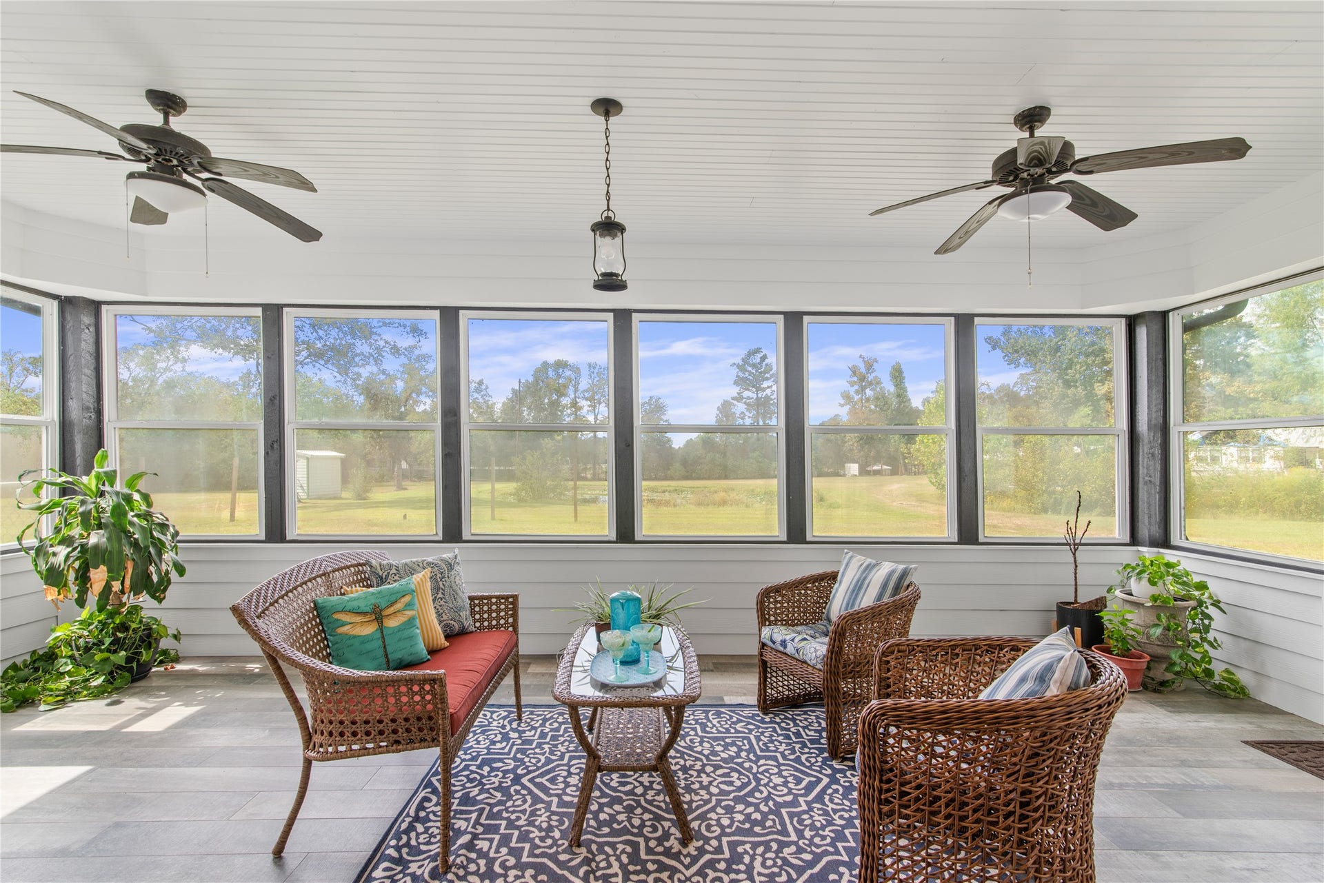 16144 Firetower Road, Conroe, TX 77306 Sunroom conveniently located off the family room and breakfast area, with two exterior doors providing easy access to the backyard.