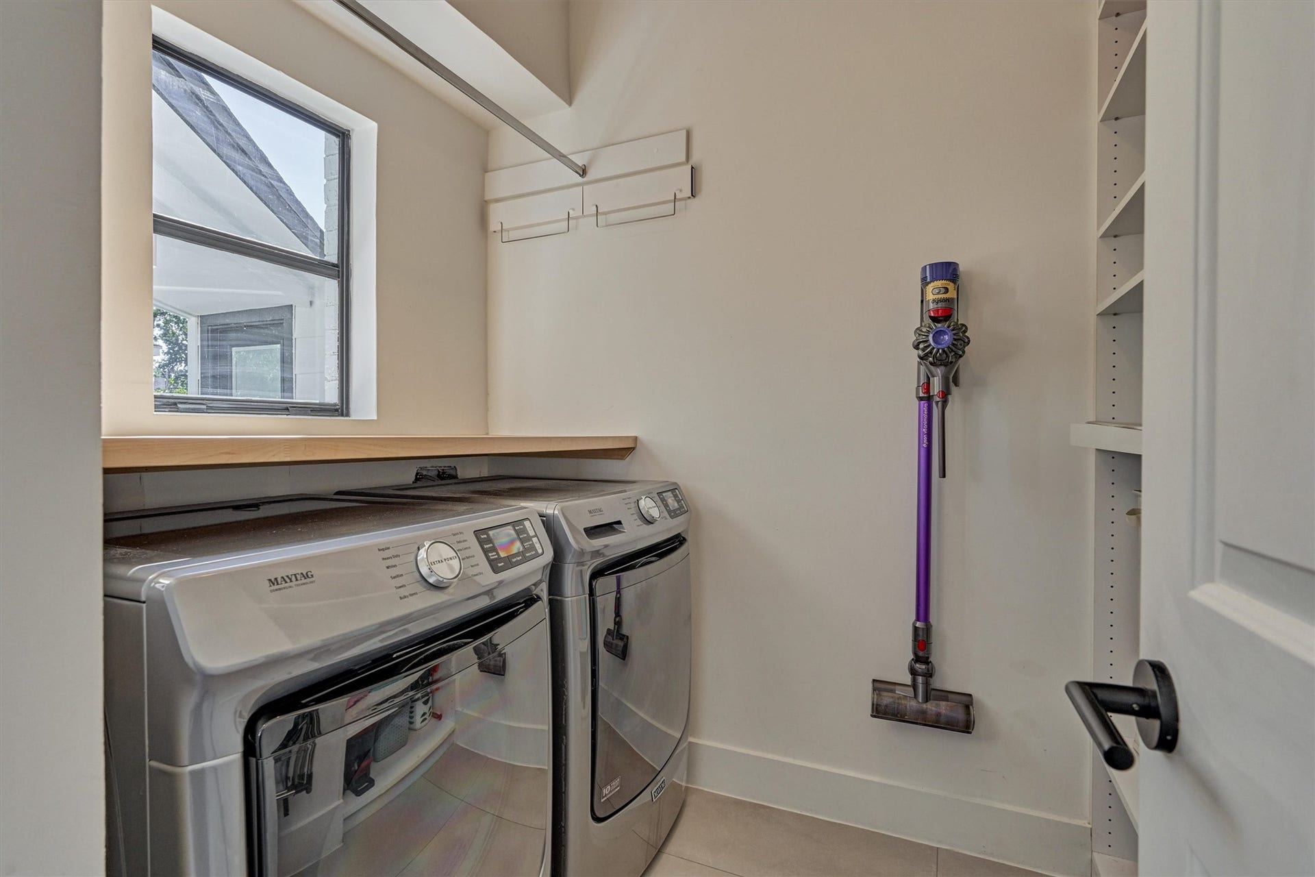 402 Susan Lane, Conroe, TX 77385 Remodeled laundry room with abundant storage options and folding space!