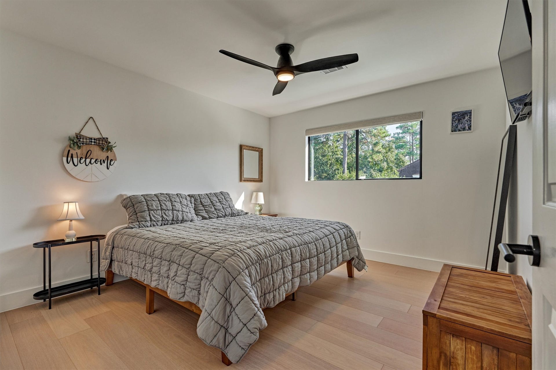 402 Susan Lane, Conroe, TX 77385 Bedroom 2 is the first of three upstairs bedrooms and can easily accommodate large furniture. Note the upgraded ceiling fan for added comfort.